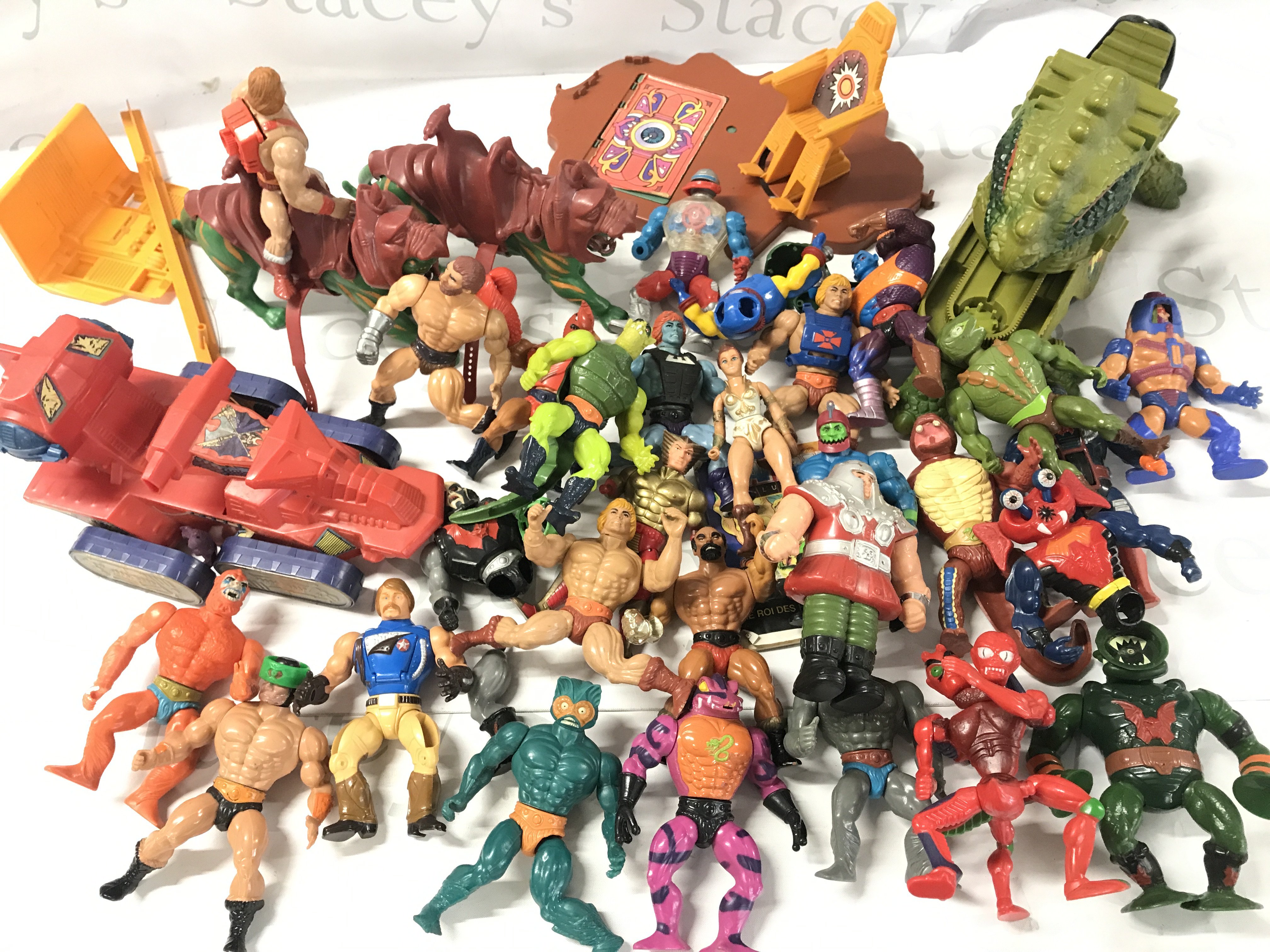 A Collection of Playworn Masters Of The Universe Figures And Accessories Including A Castle Greyskull. No Reserve.