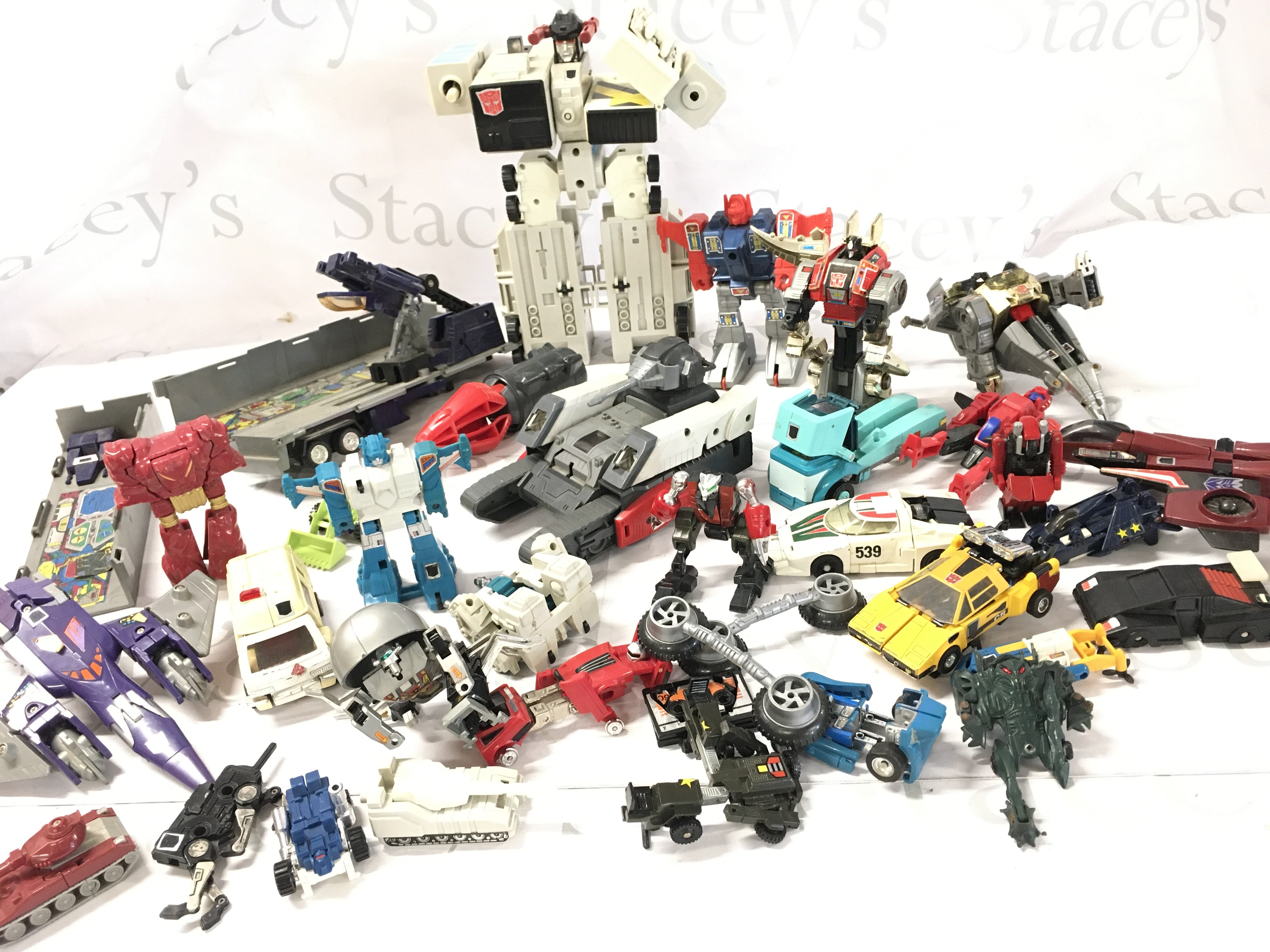 A Box Containing Various Transformer Type Toys. Ideal For Spare Parts.