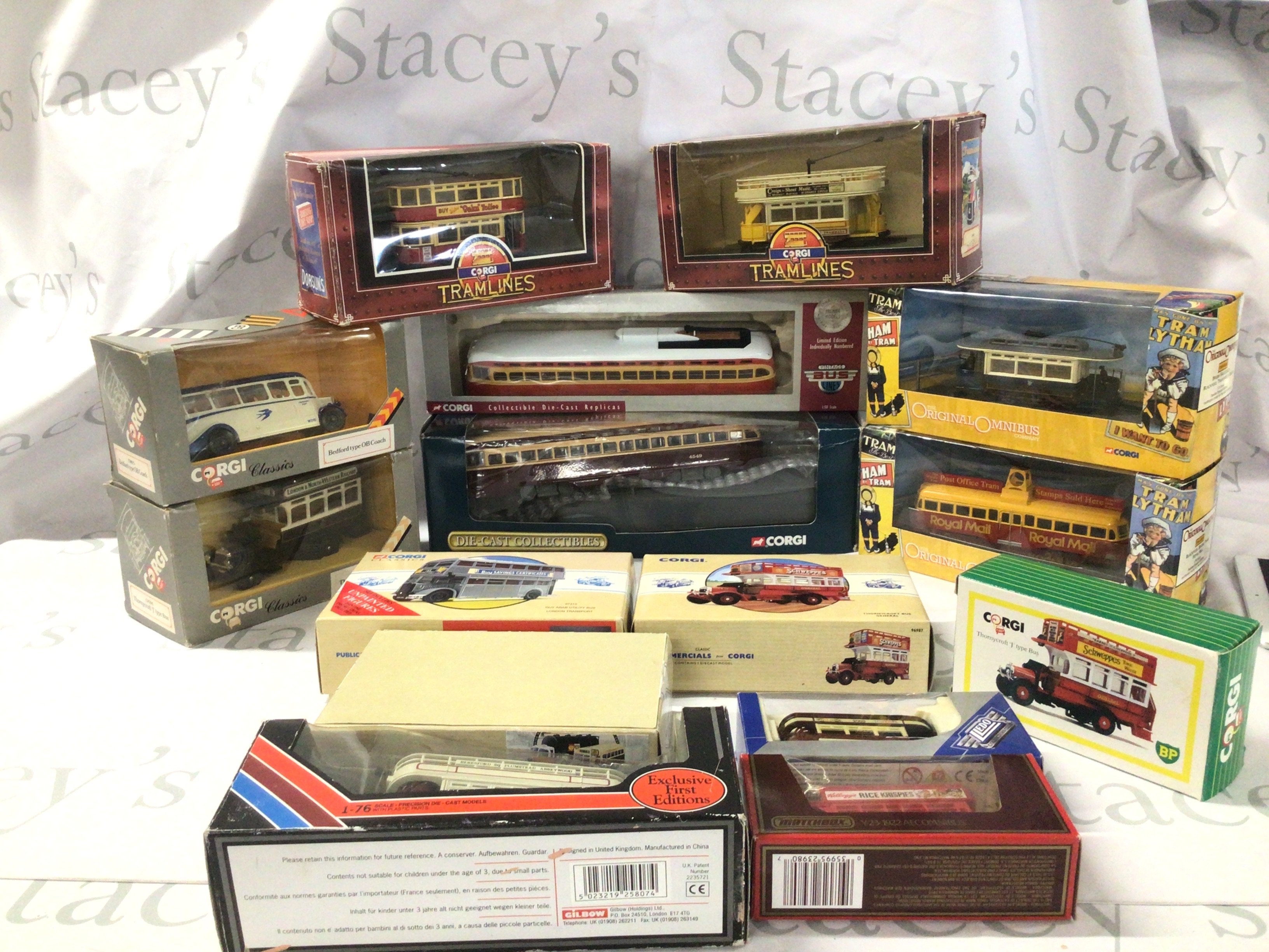 A collection of boxed model buses and trams by Corgi and others.