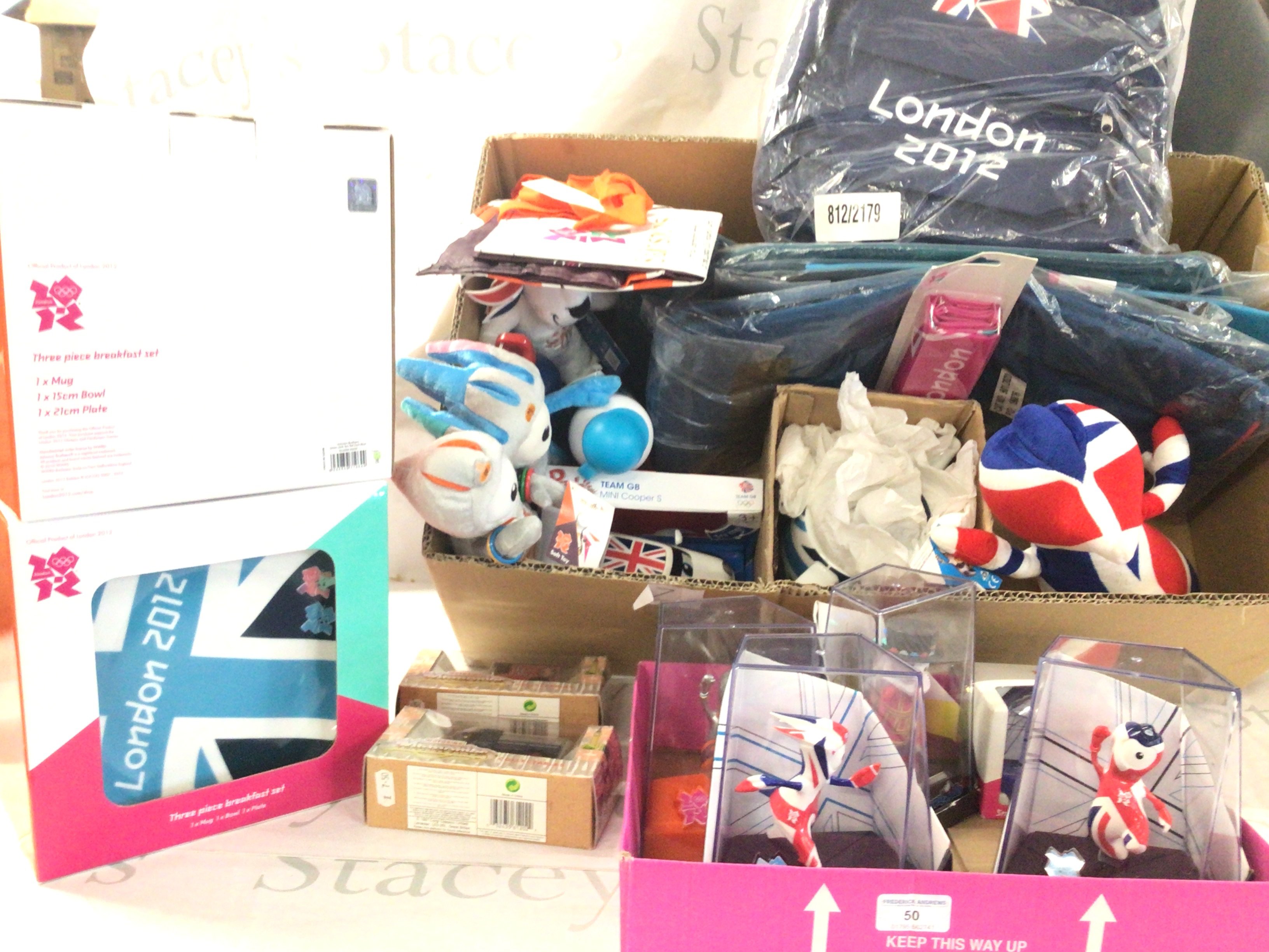 A collection of Olympic memorabilia from London 2012 includes boxed breakfast sets..mascots..vehicles..teapot etc