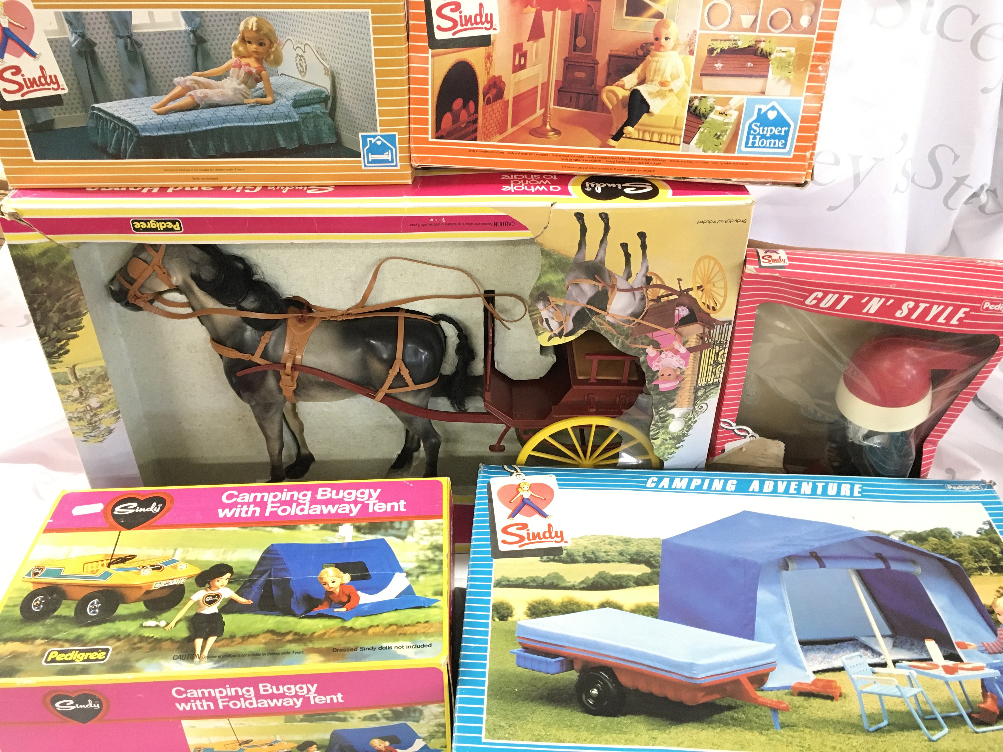 A Large Collection of Boxed And Loose Sindy Furniture. Vehicles and Accessories including A Sindy Super Home. This Lot cannot Be Posted.(7).