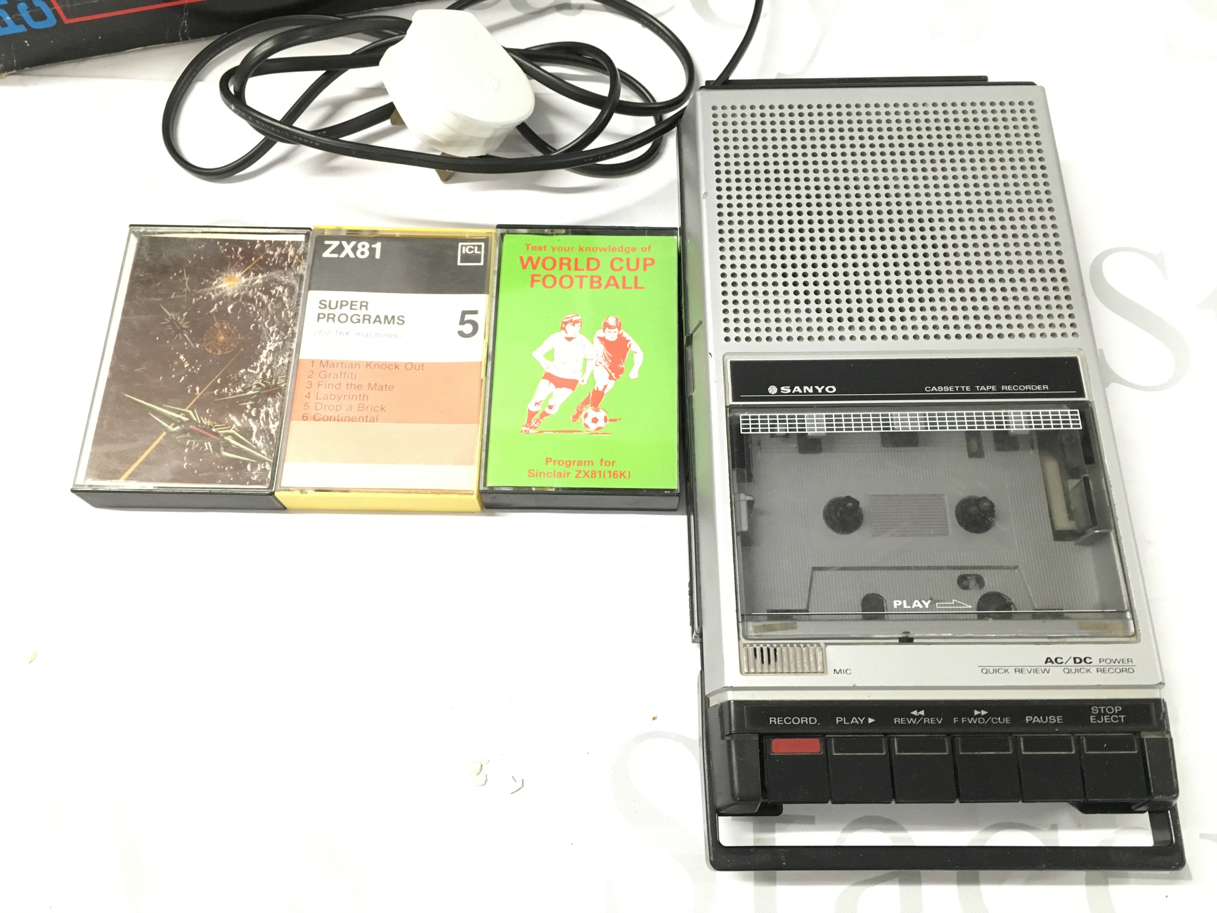 A Boxed Sinclair ZX81 With 16K Ram. A Sanyo Cassette Recorder and Software.