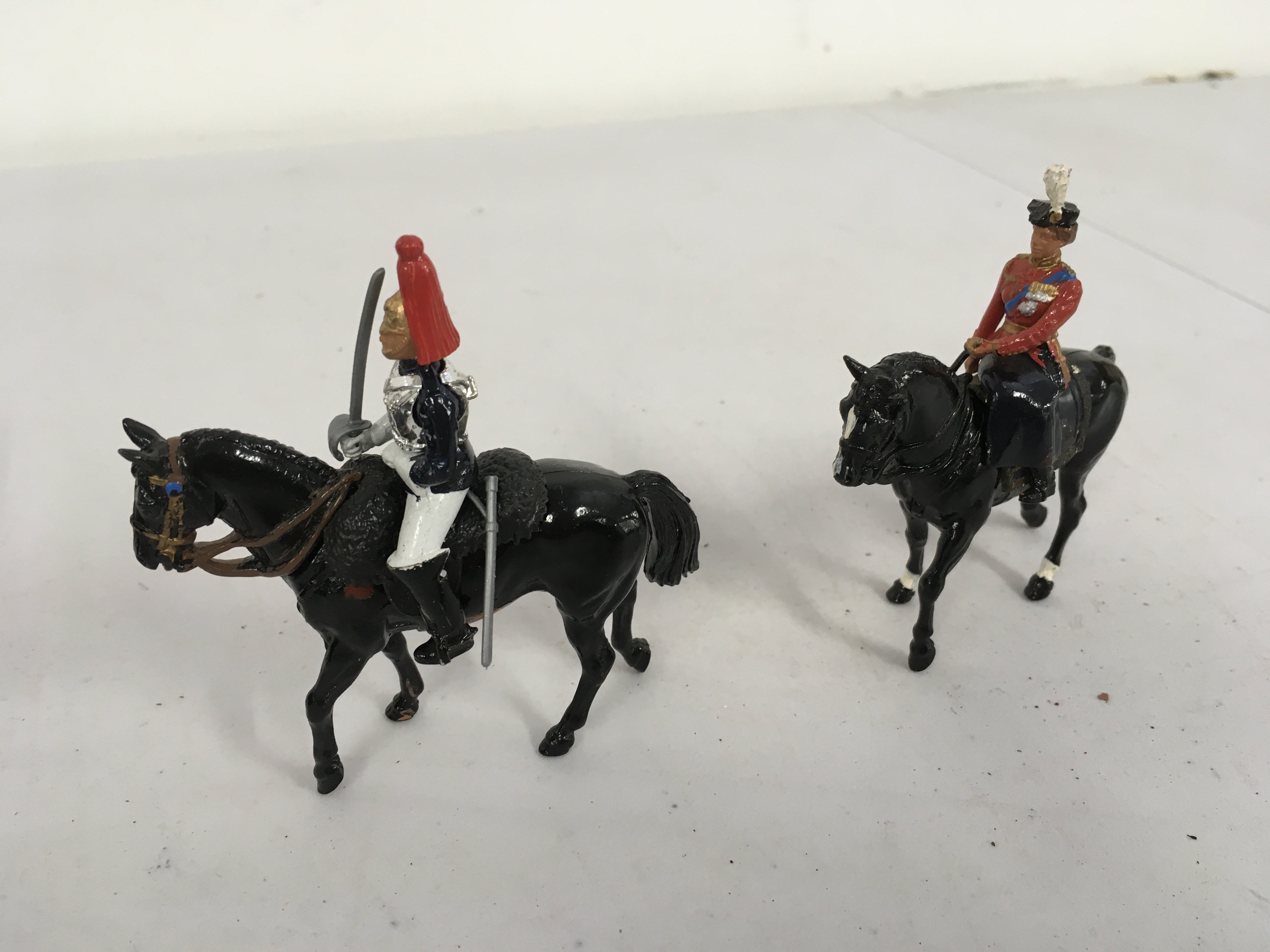 Loose metal Britains Mounted HH Queen also Mounted Blues and Royals Officer. No reserve.
