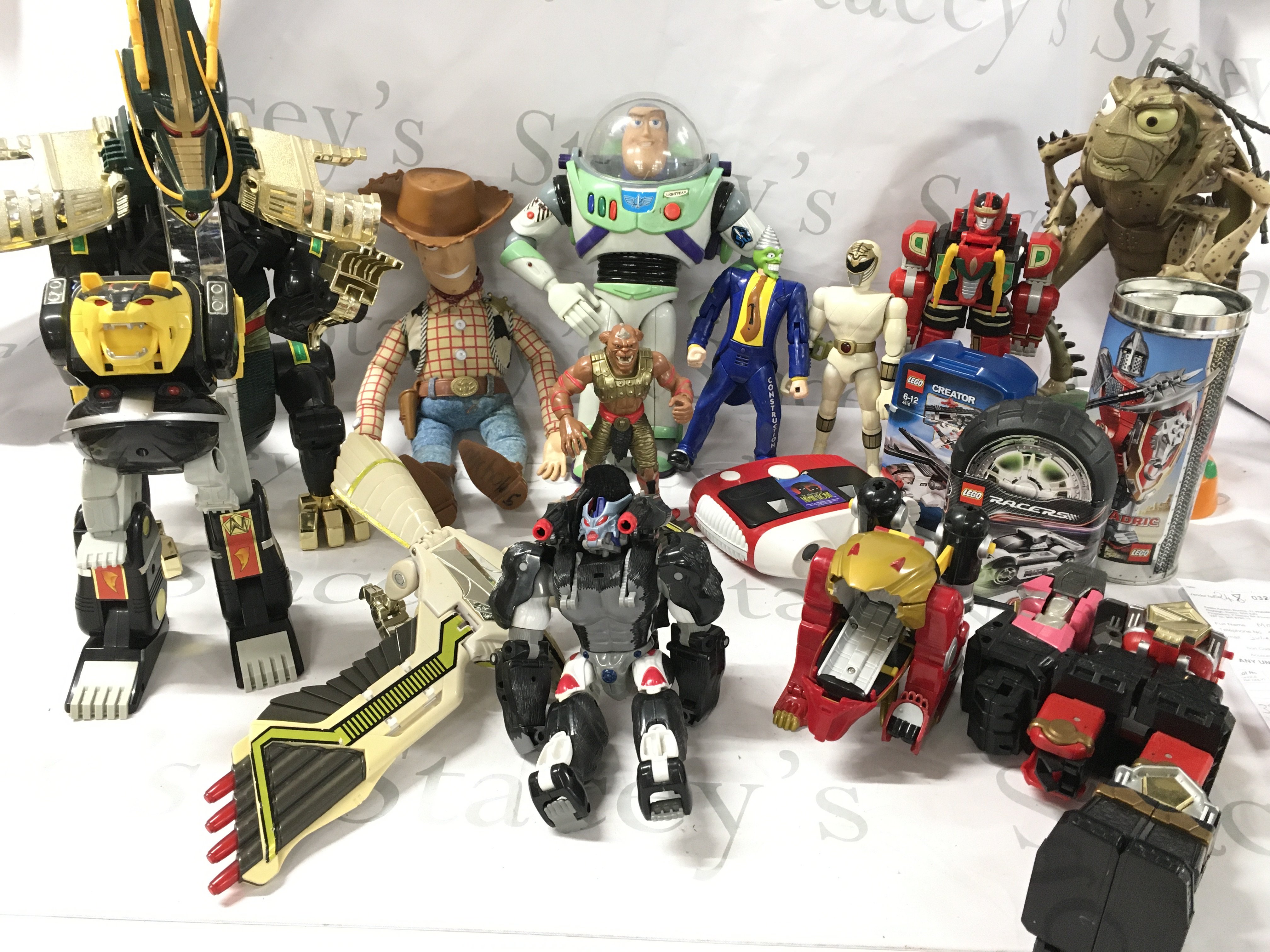 A Box Containing Playworn Toys Including Power Rangers. Toy Story And Lego.