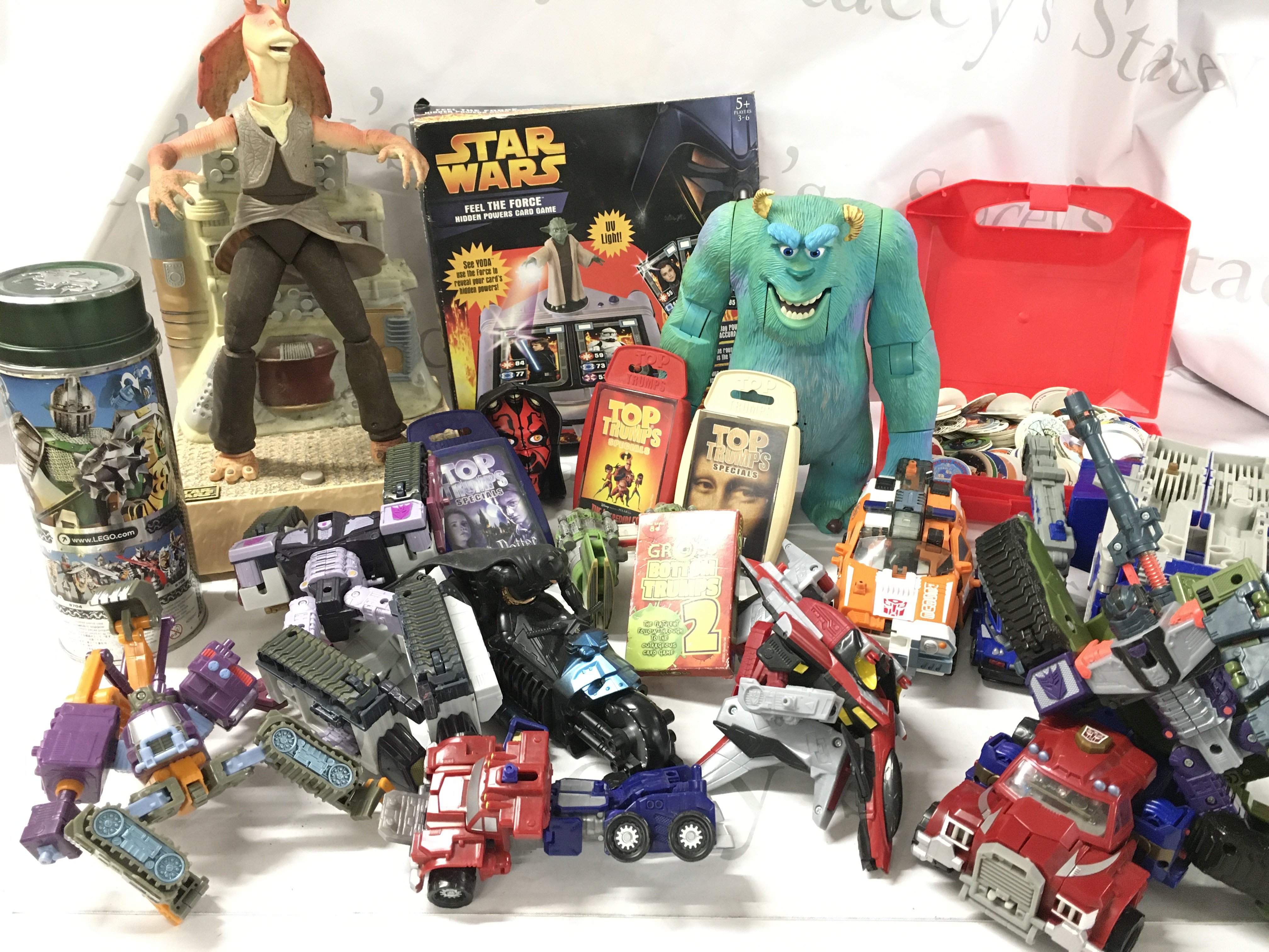 A Collection Of Playworn Toys Including Transformers. Star Wars. Top Trumps. Etc.