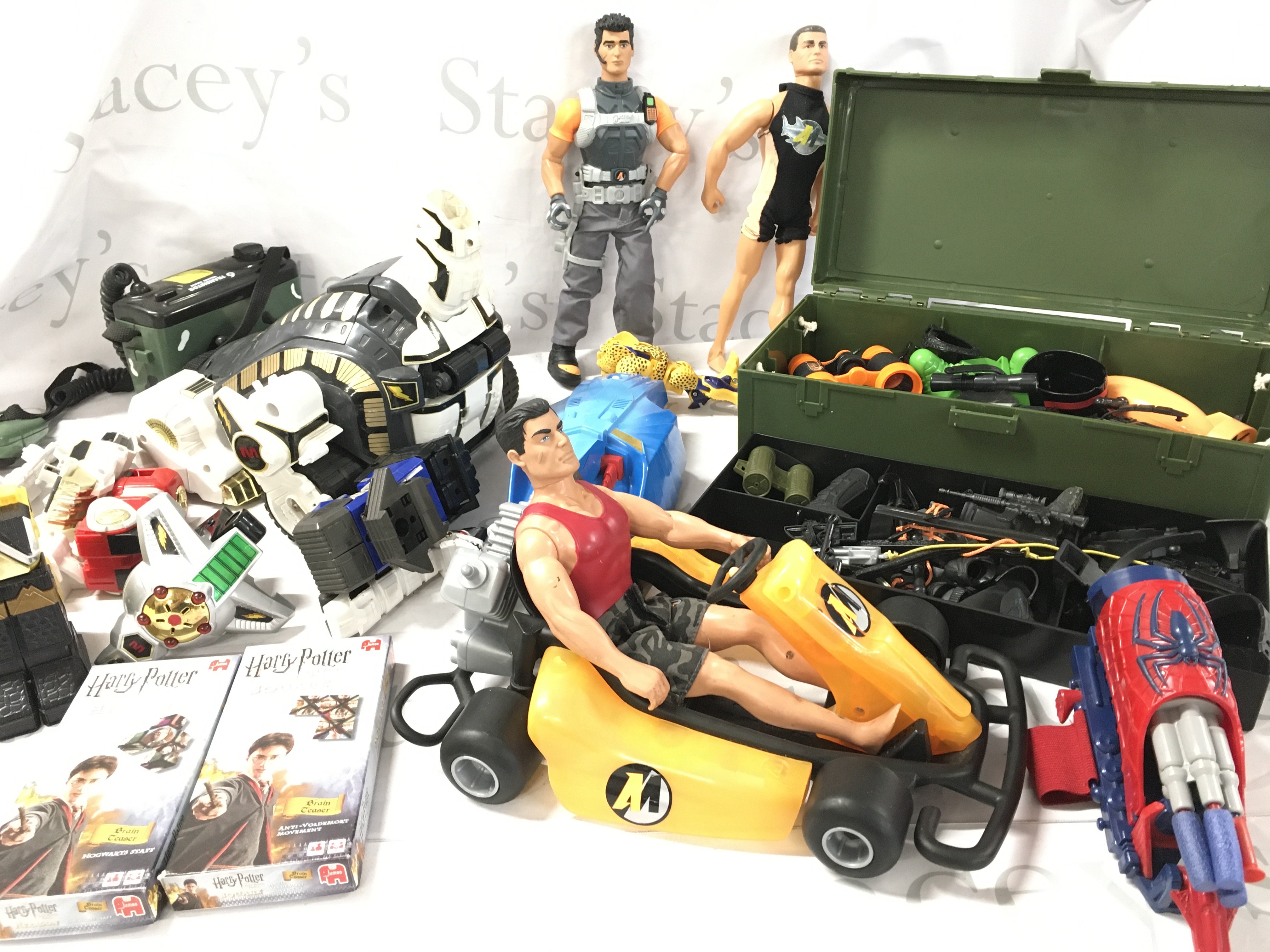 A Collection Of Playworn Toys Including Action Man. Power Rangers And Harry Potter etc.
