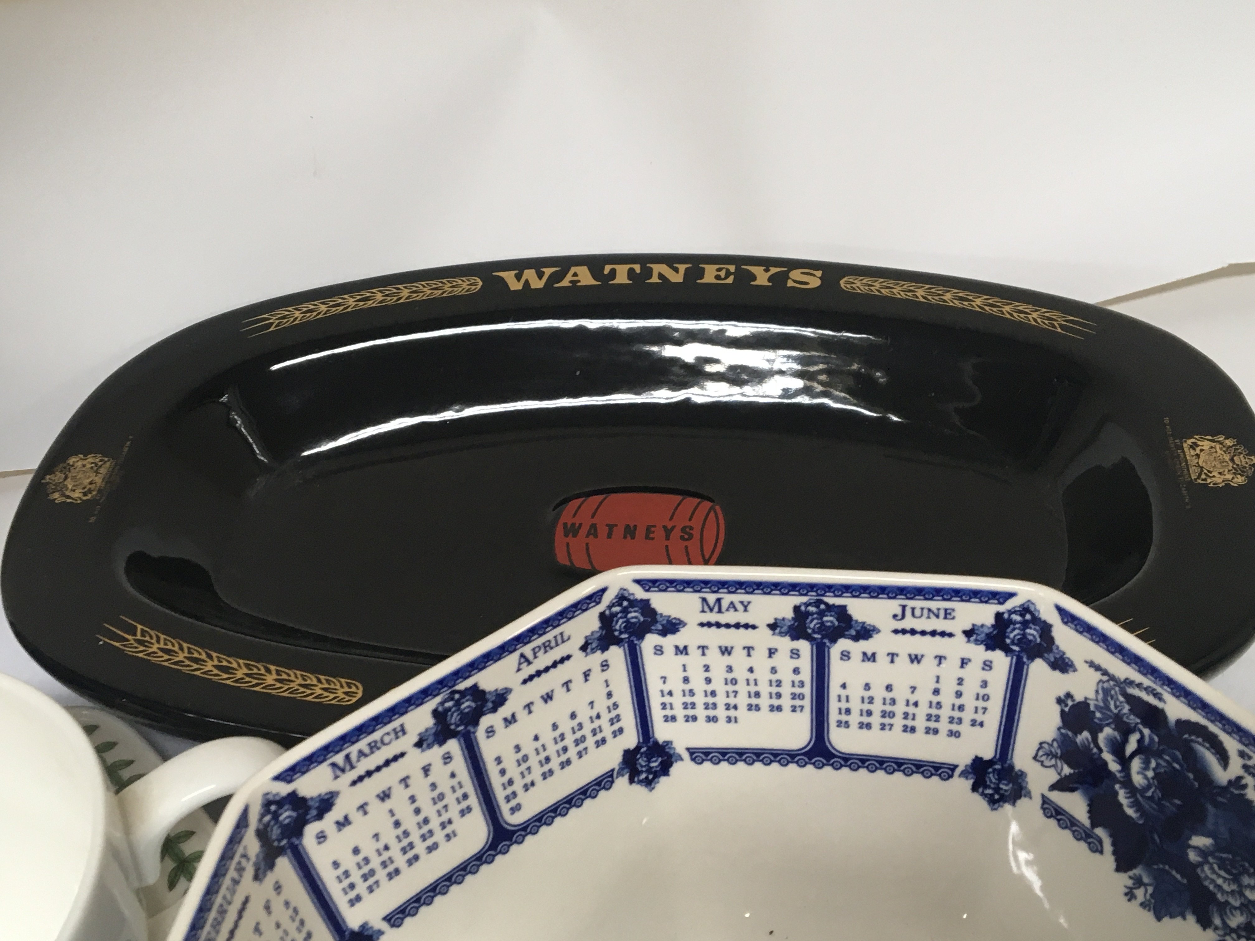 A collection of ceramics A Wedgwood blue and white calender bowl a Watneys Advertising dish large blue and white vase and large Portmeirion cup and dish no obvious damage. NO RESERVE