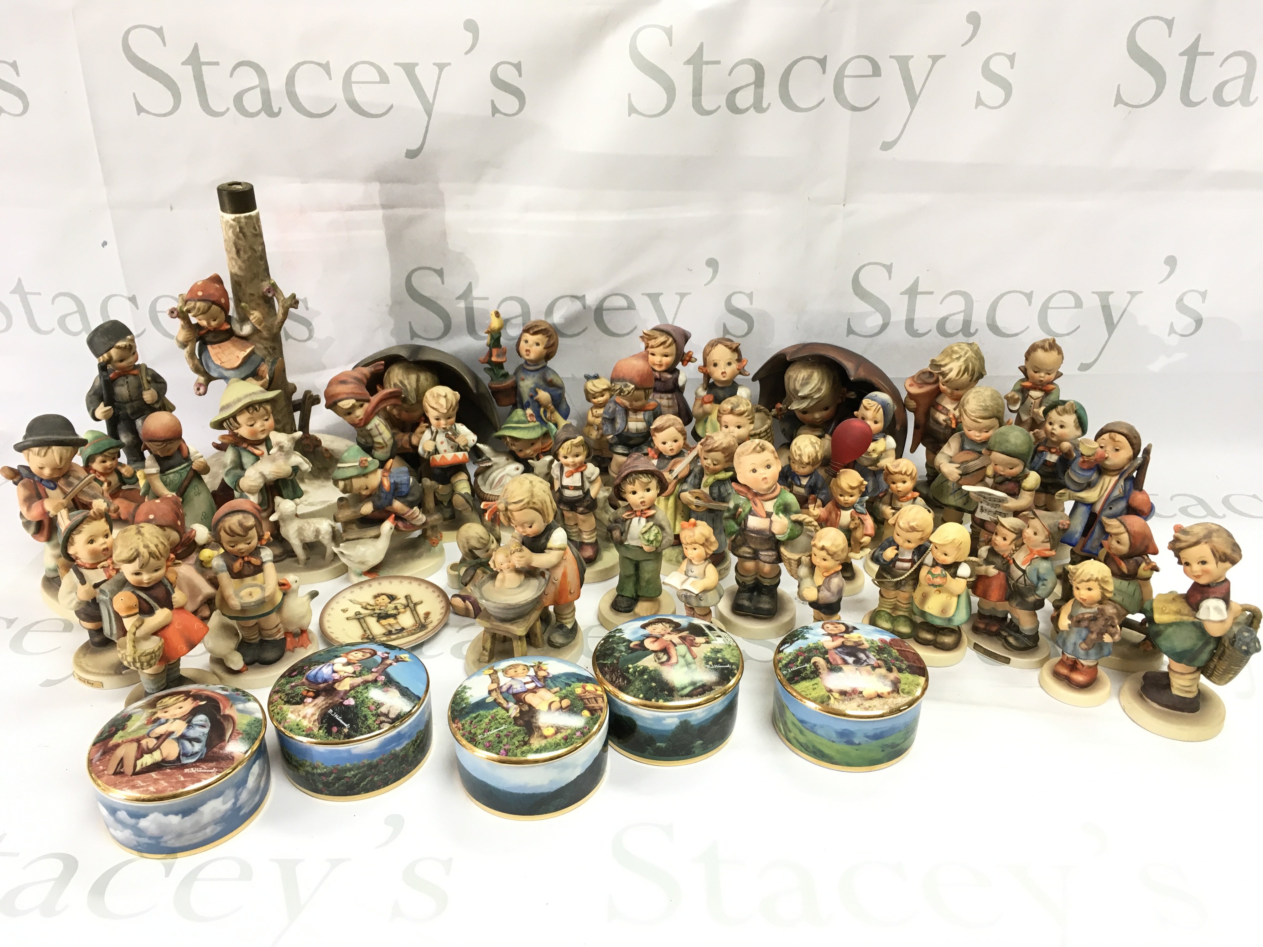 A large collection of porcelain Hummel figures and some Danbury Mint Hummel music boxes. This lot cannot be posted
