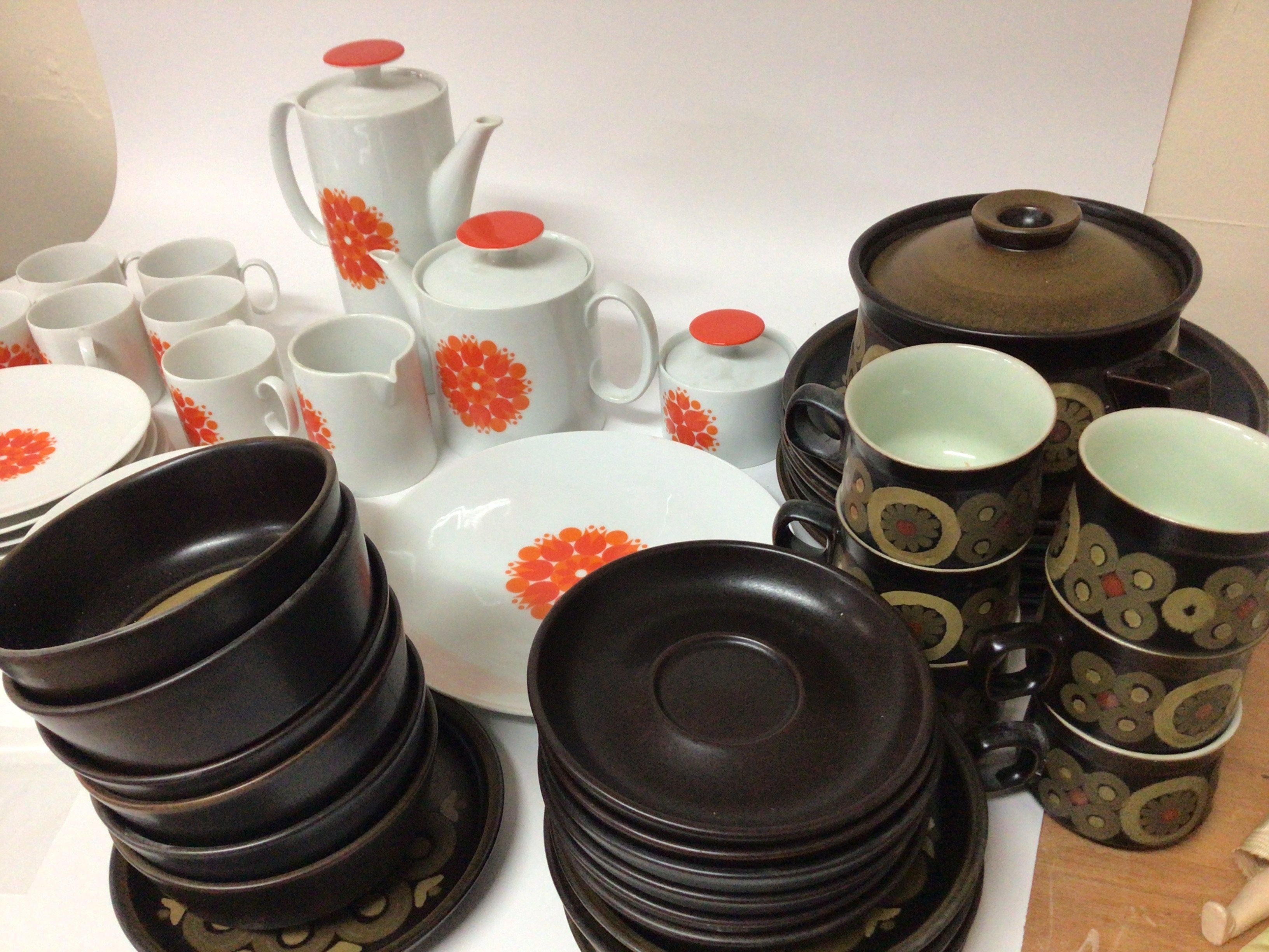 A mid 20th century design Thomas German porcelain tea coffee set with a an orange modern design pattern and a Denby ceramic dinner and tea set dark brown pattern. NO RESERVE