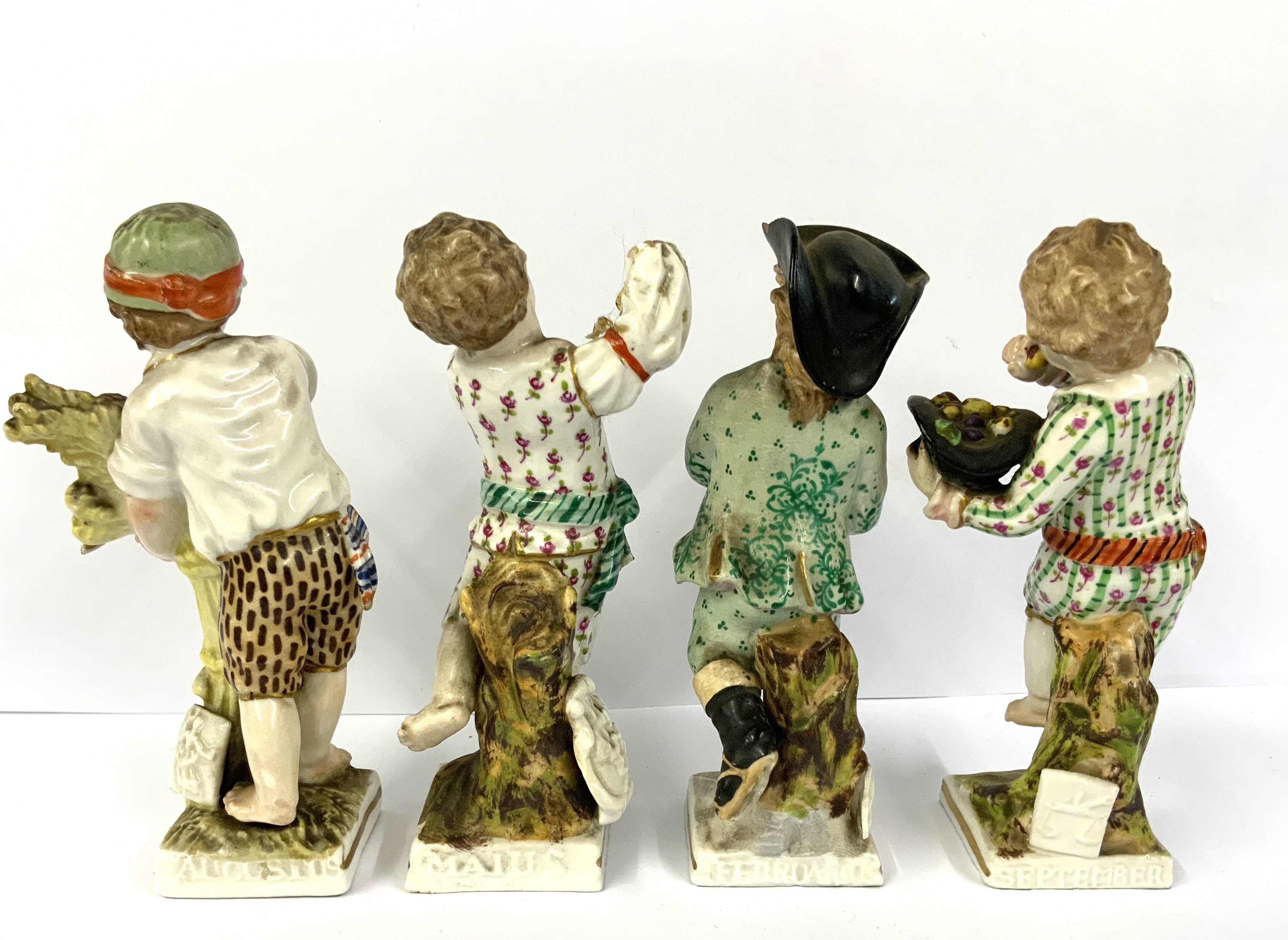 Four early KPM porcelain figures of children depicting months of the year. 10.5cm. NO RESERVE