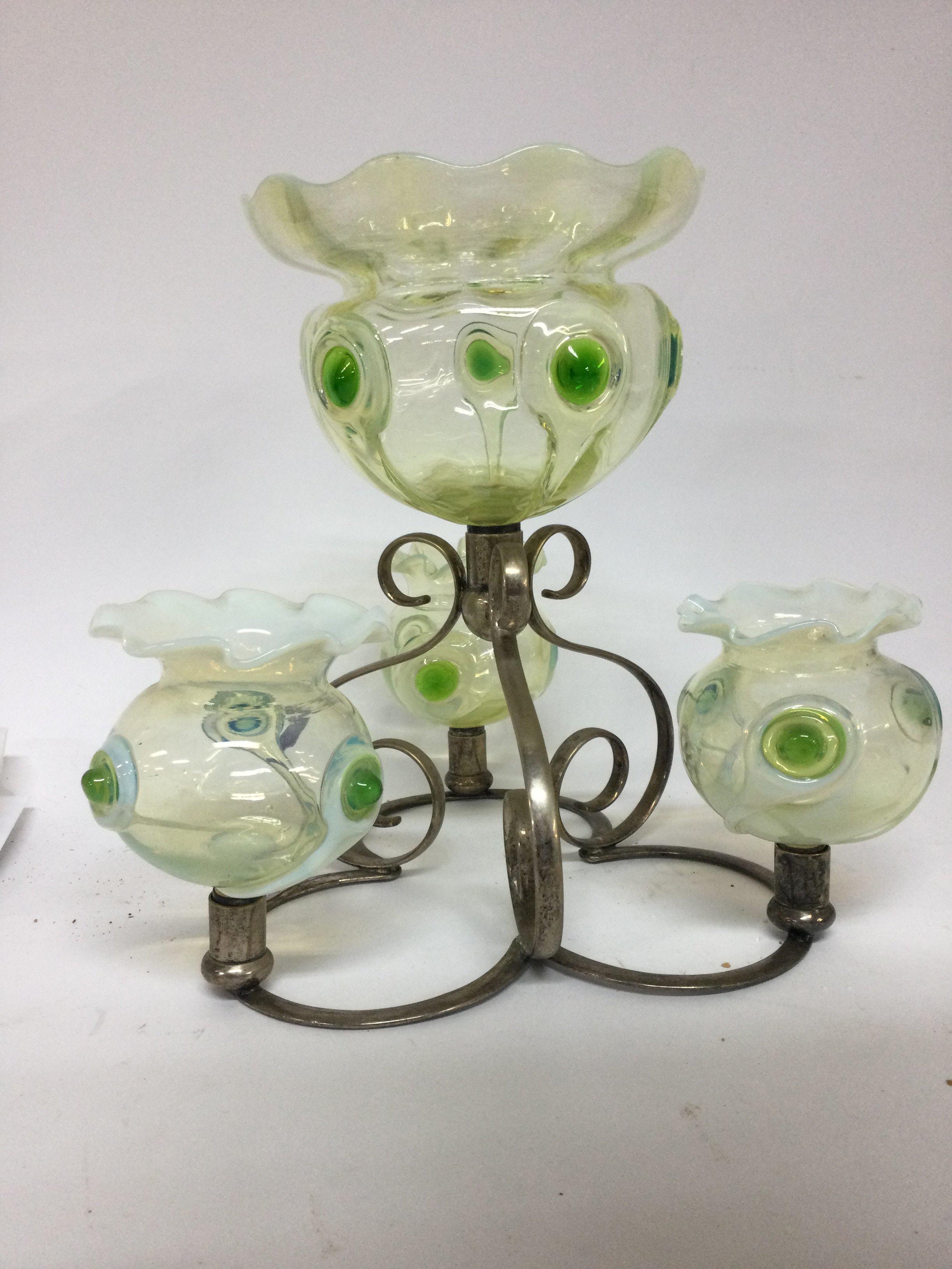 A glass and silver plated epergne inset with with four green opaque glass bowls having Art nouveau Influences. 25 cm .