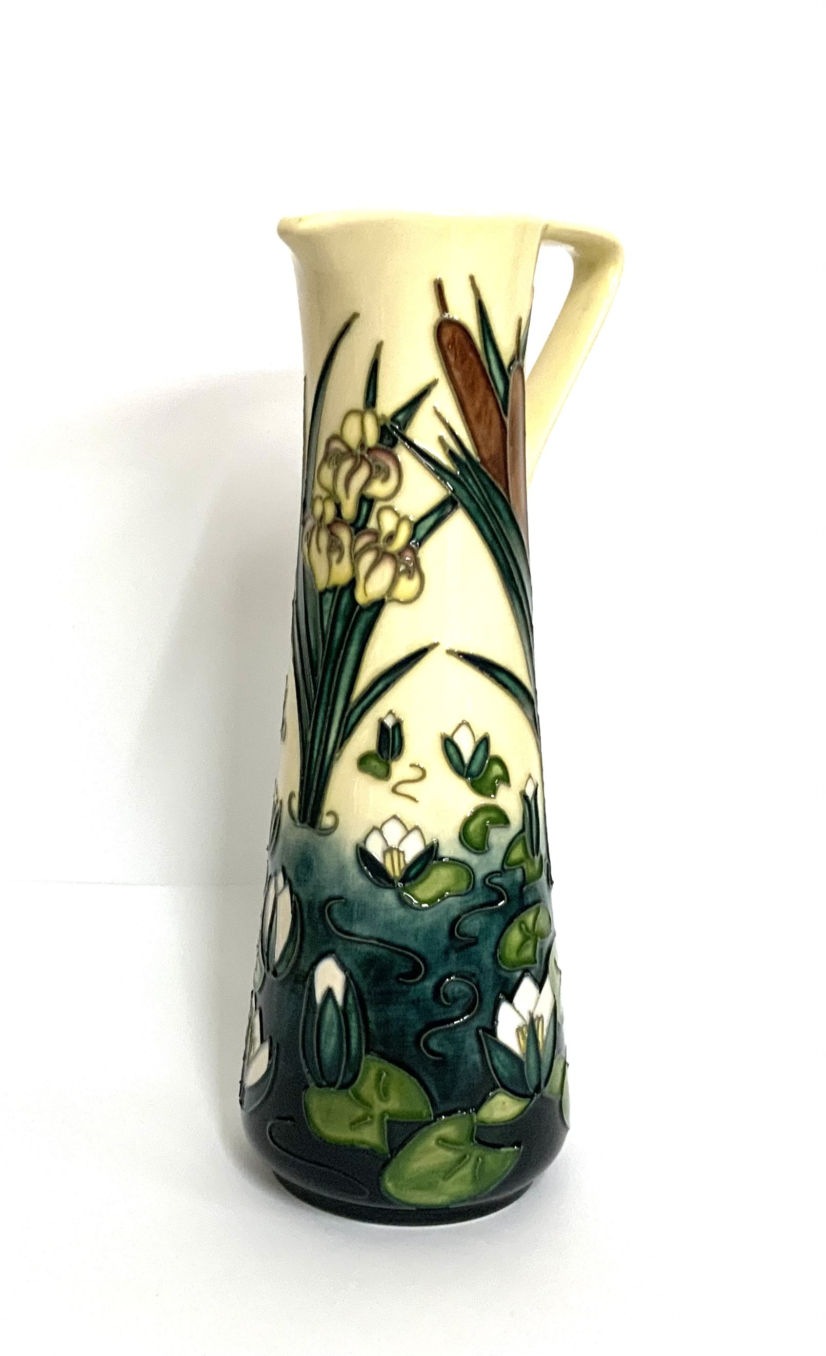 A modern Moorcroft, Lamia pattern jug designed by Rachel Bishop, the cream ground decorated with flowers, dated '95, impressed marks 23cm