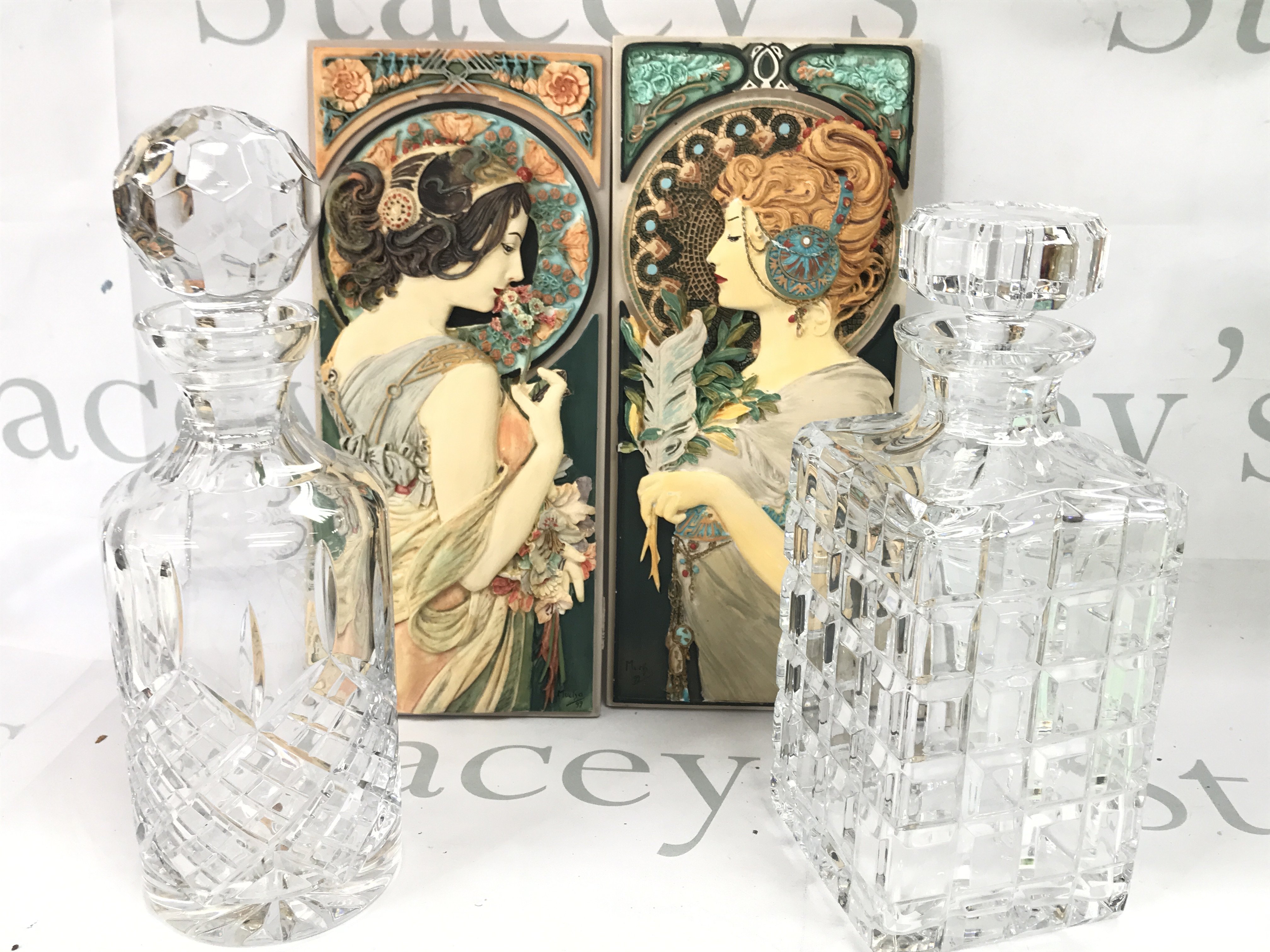 Decanters , one being Atlantis. Art nouveau style plaques. This lot cannot be posted