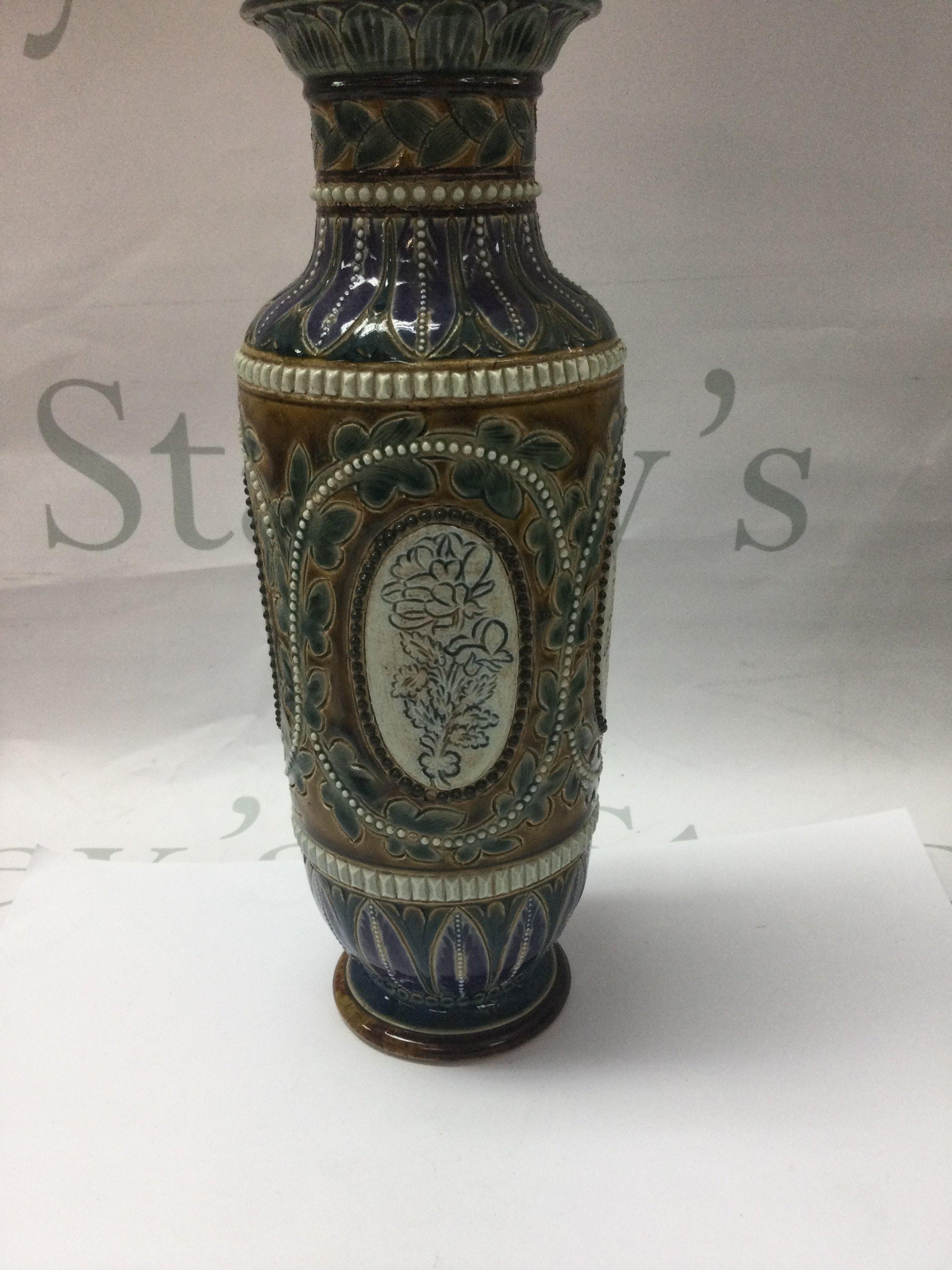 A Doulton Lambeth vase. Decorated with flowers and foilage by Bessie Youat , 25 cm .