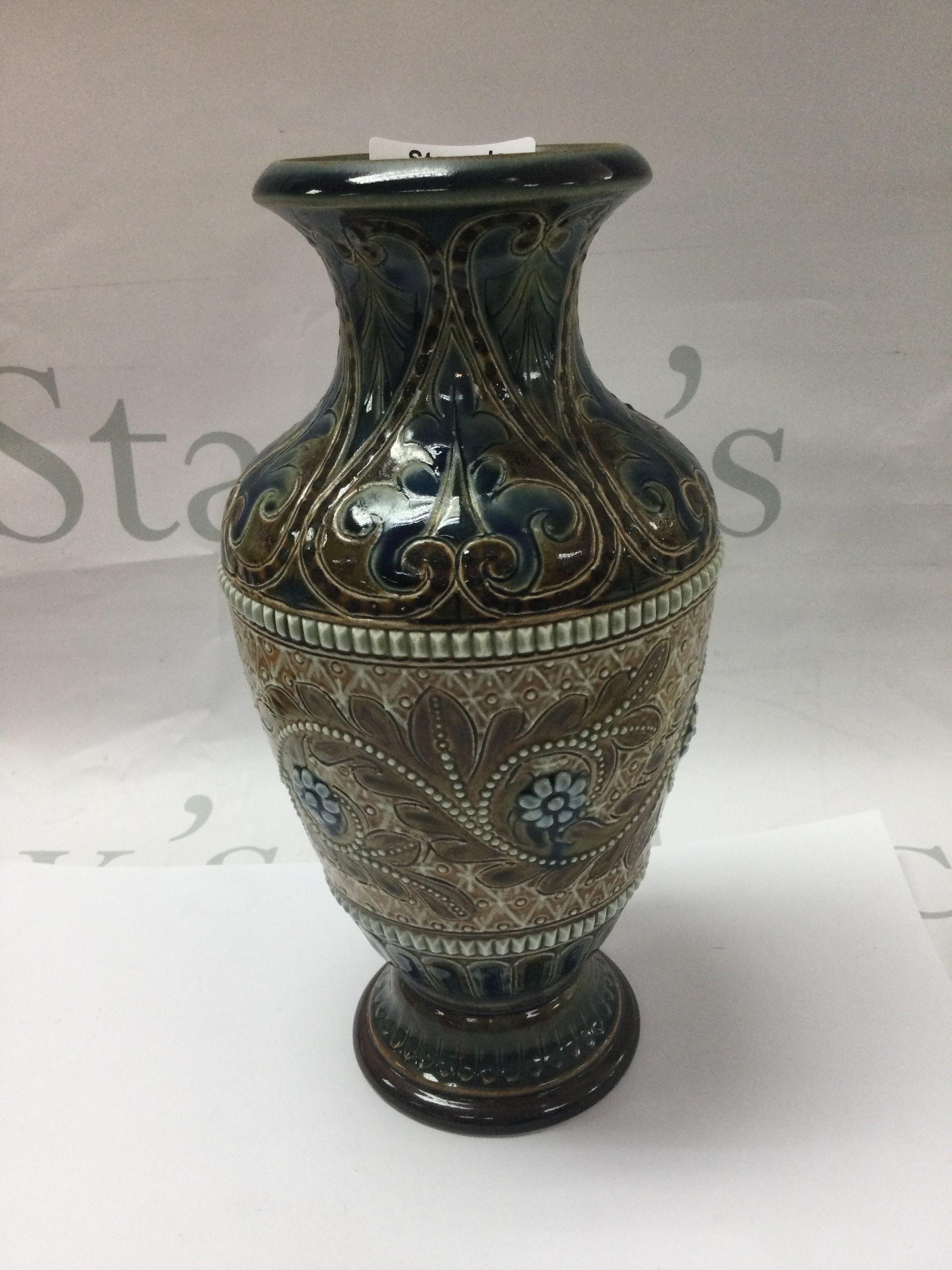 A Doulton Lambeth vase with floral decorations 22 cm