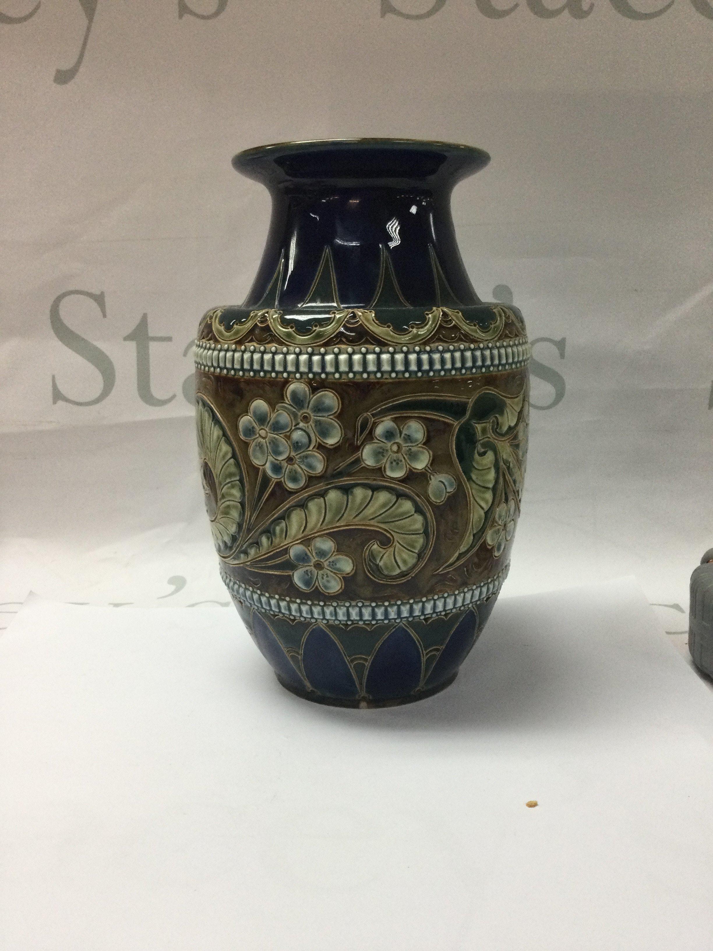 A Doulton Lambeth Art union of London vase by ELiza Simance . 20 cm Decorated with floral design.