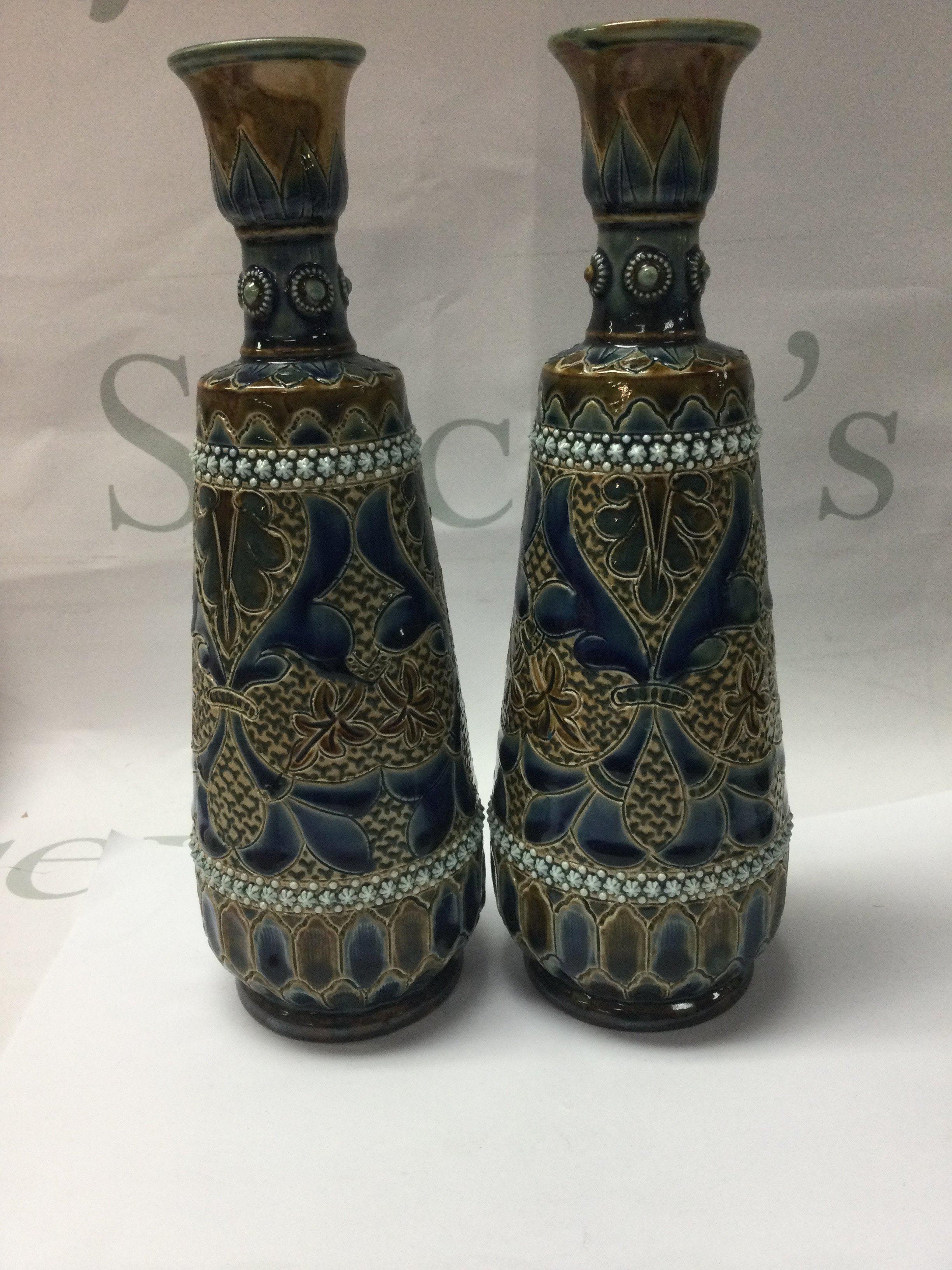 A pair of Doulton Lambeth ELizabeth Fisher vases decorated with floral Design.. 23 cm .