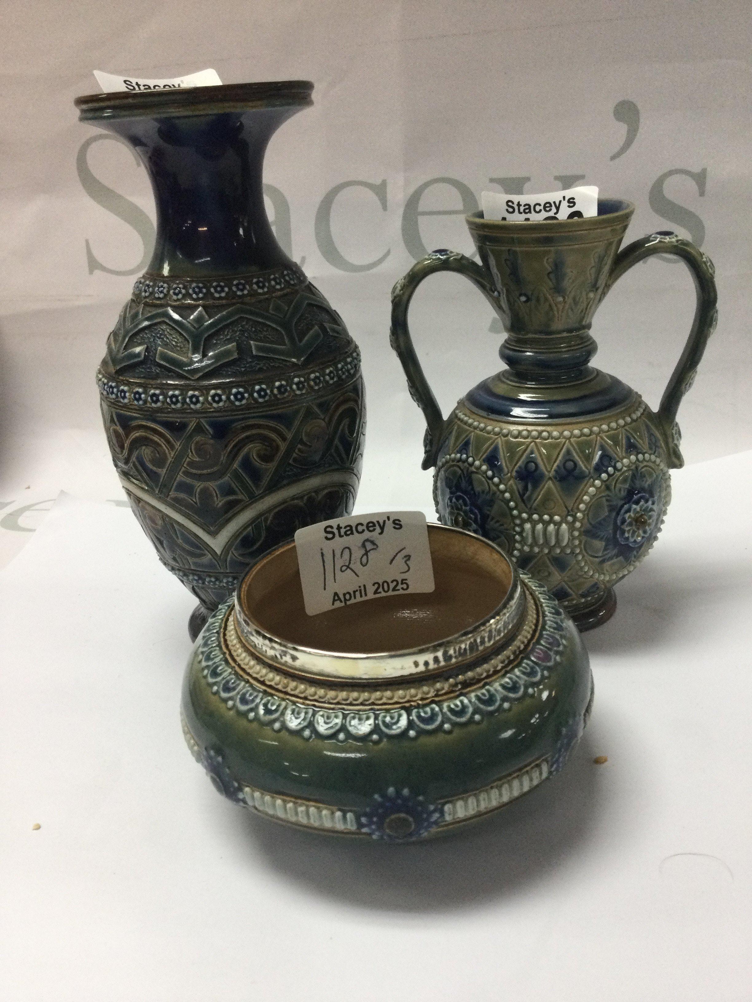 Three pieces of Doulton Lambeth stone ware including twin handle vase By Eliza Simmance a small bowl by Emily Partington.and one other vase