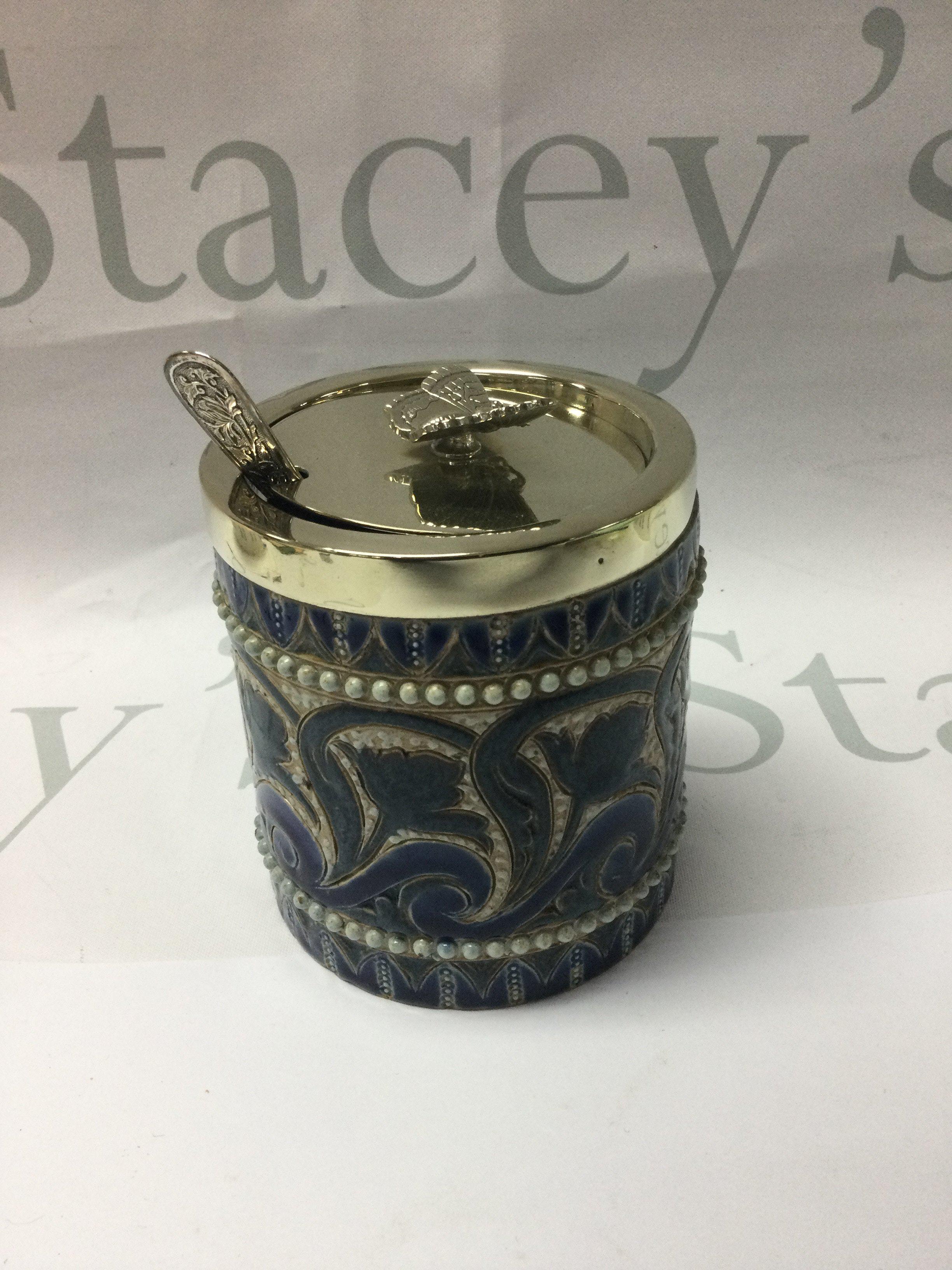 A Doulton Lambeth preserve pot by Edith Lupton the silver plated lid with raised butterfly 10 cm .