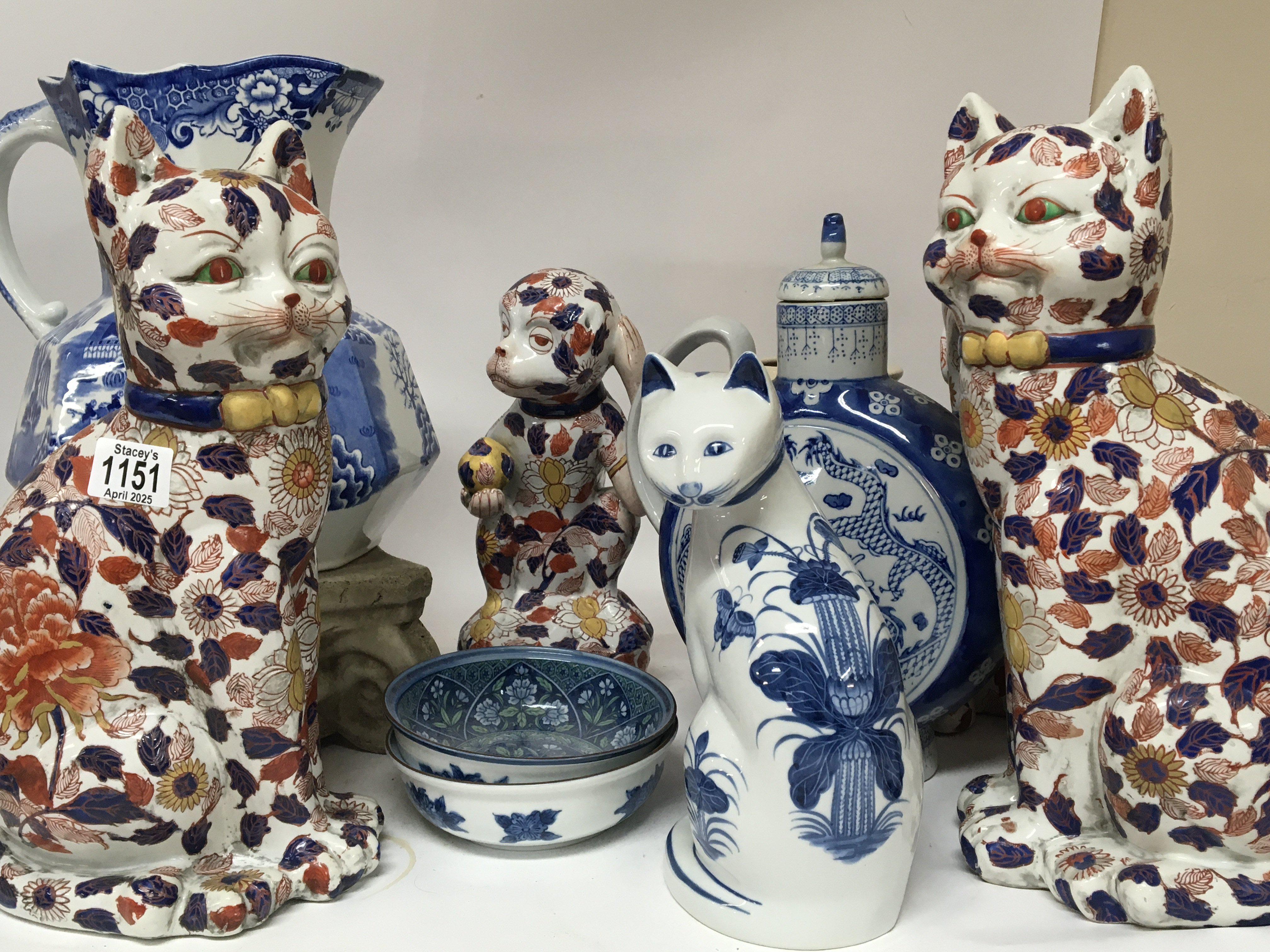 A collection of ceramics a large Masons blue and white jug 20th Century Chinese cat and monkey figures and other ceramics.