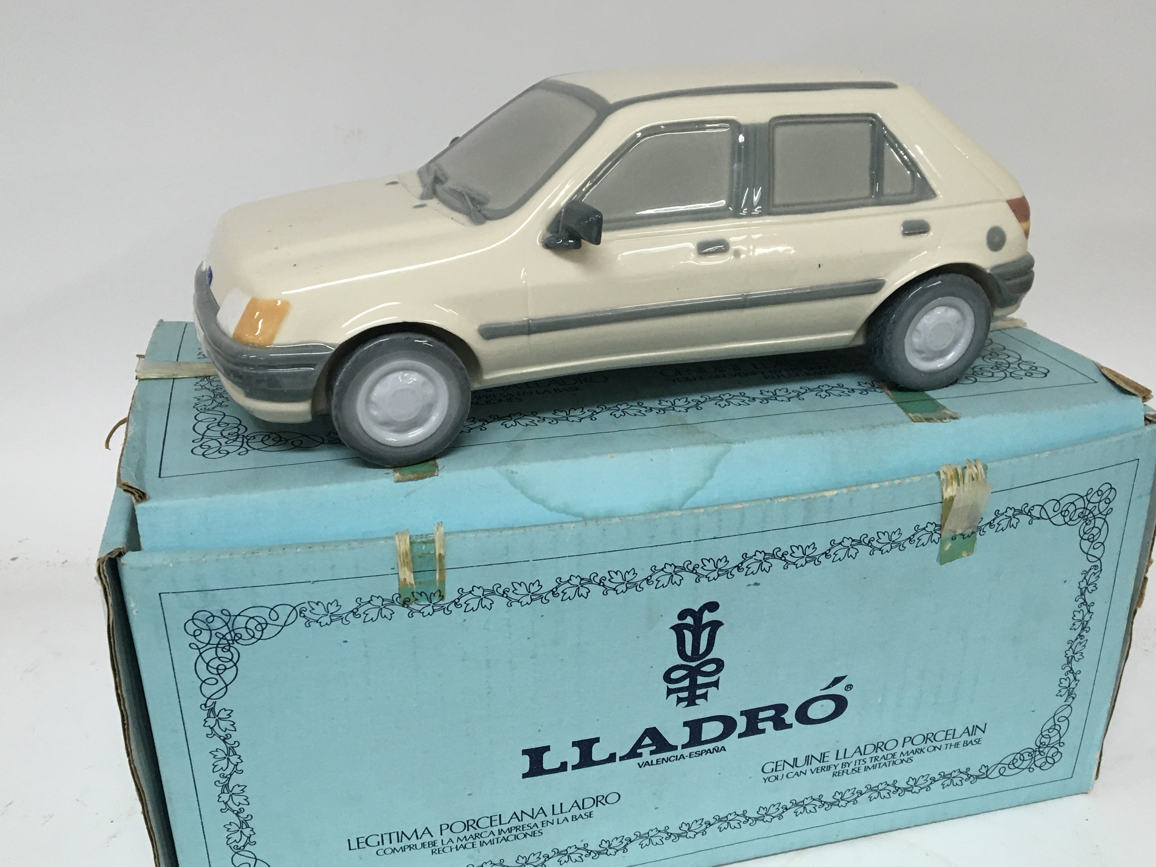 A Lladro model of a 1989 Ford Fiesta. With box no damage.