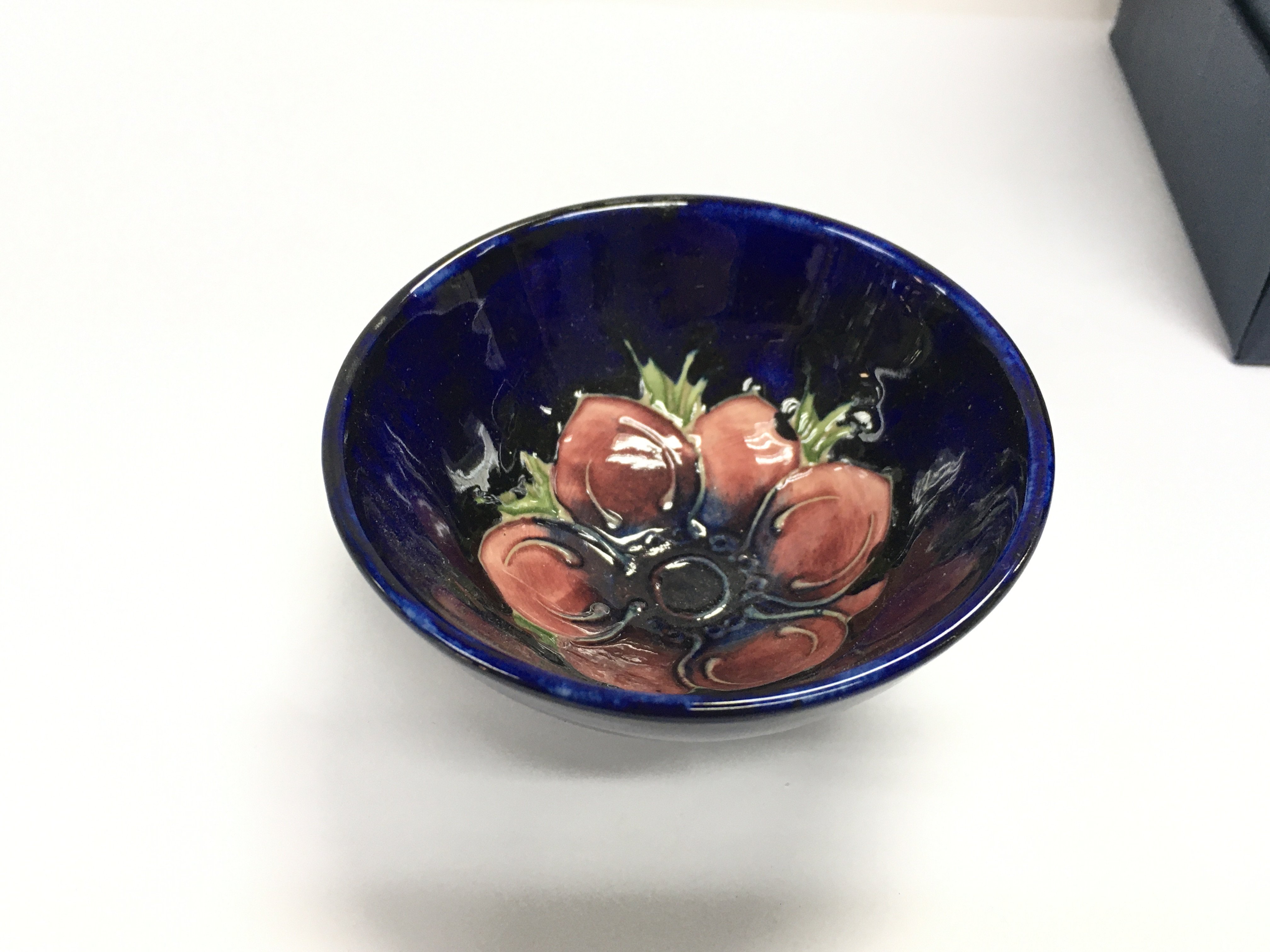 A small boxed moorcroft bowl. 9cm diameter.