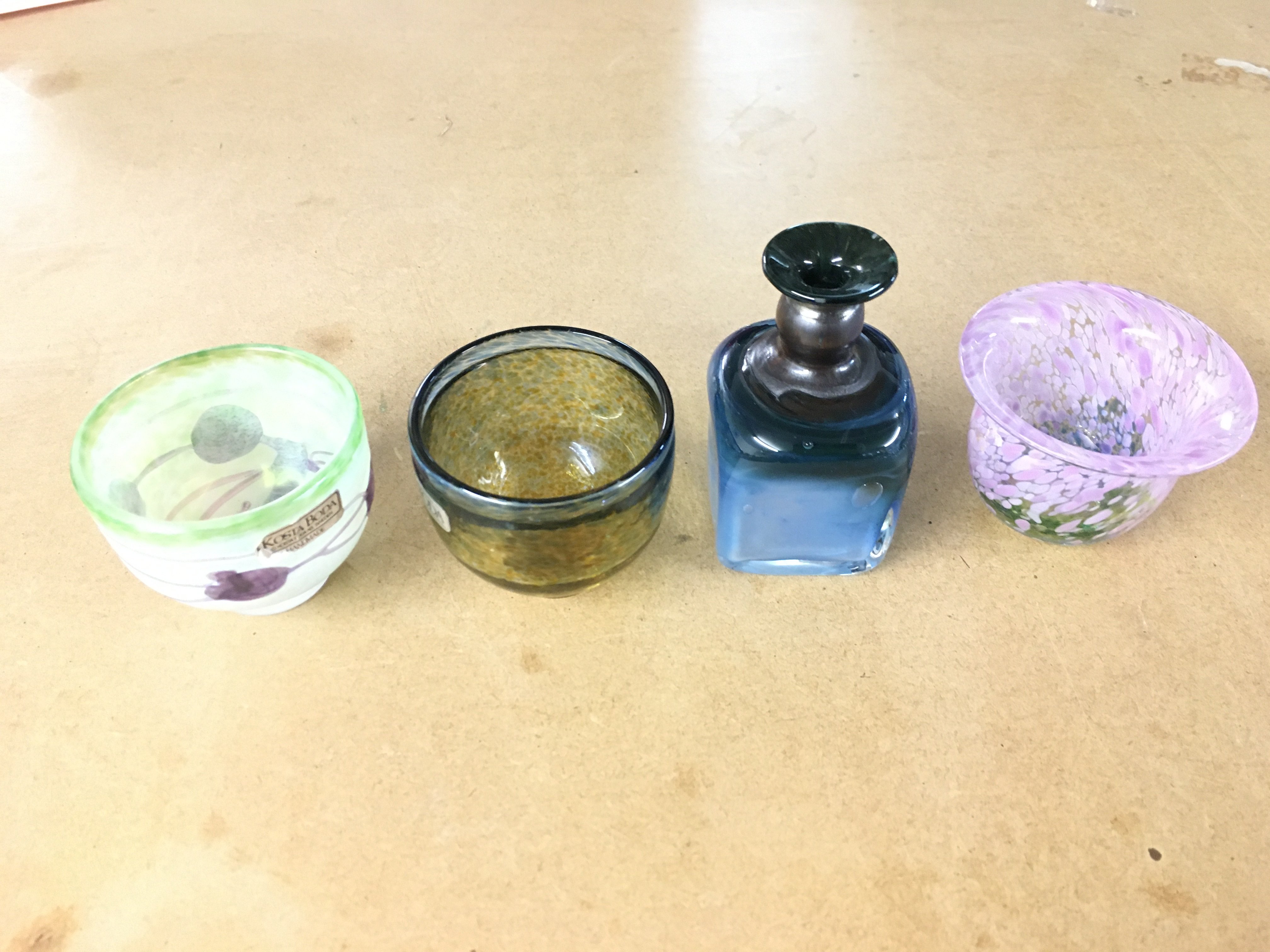 Four Kosta Boda miniatures from Galaxy and Satellite ranges by Bertil Vallien and Ulsica Hydman Vallien