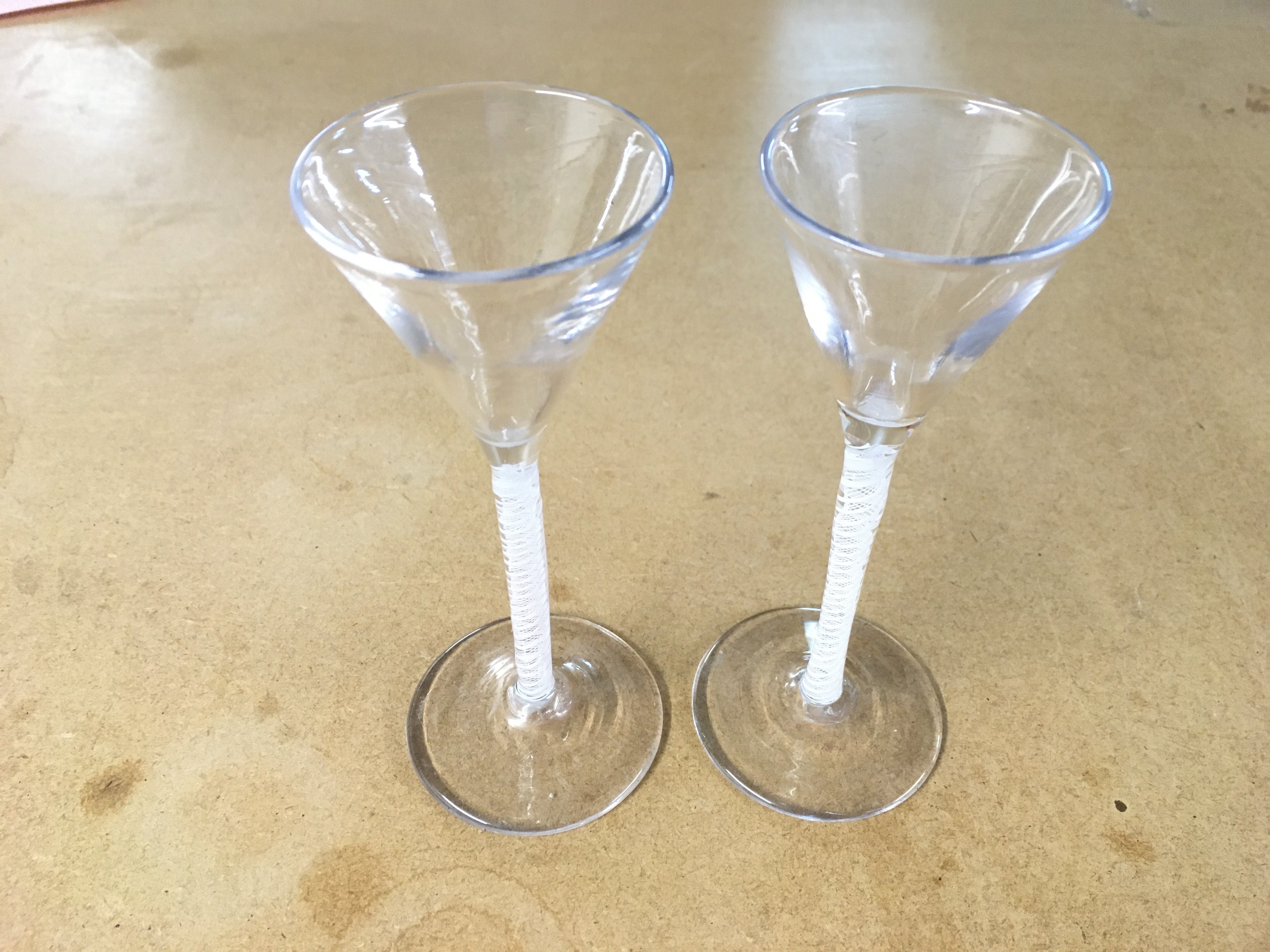 A apir of late 18th century opaque twist glasses. 11.5cm tall. Good condition