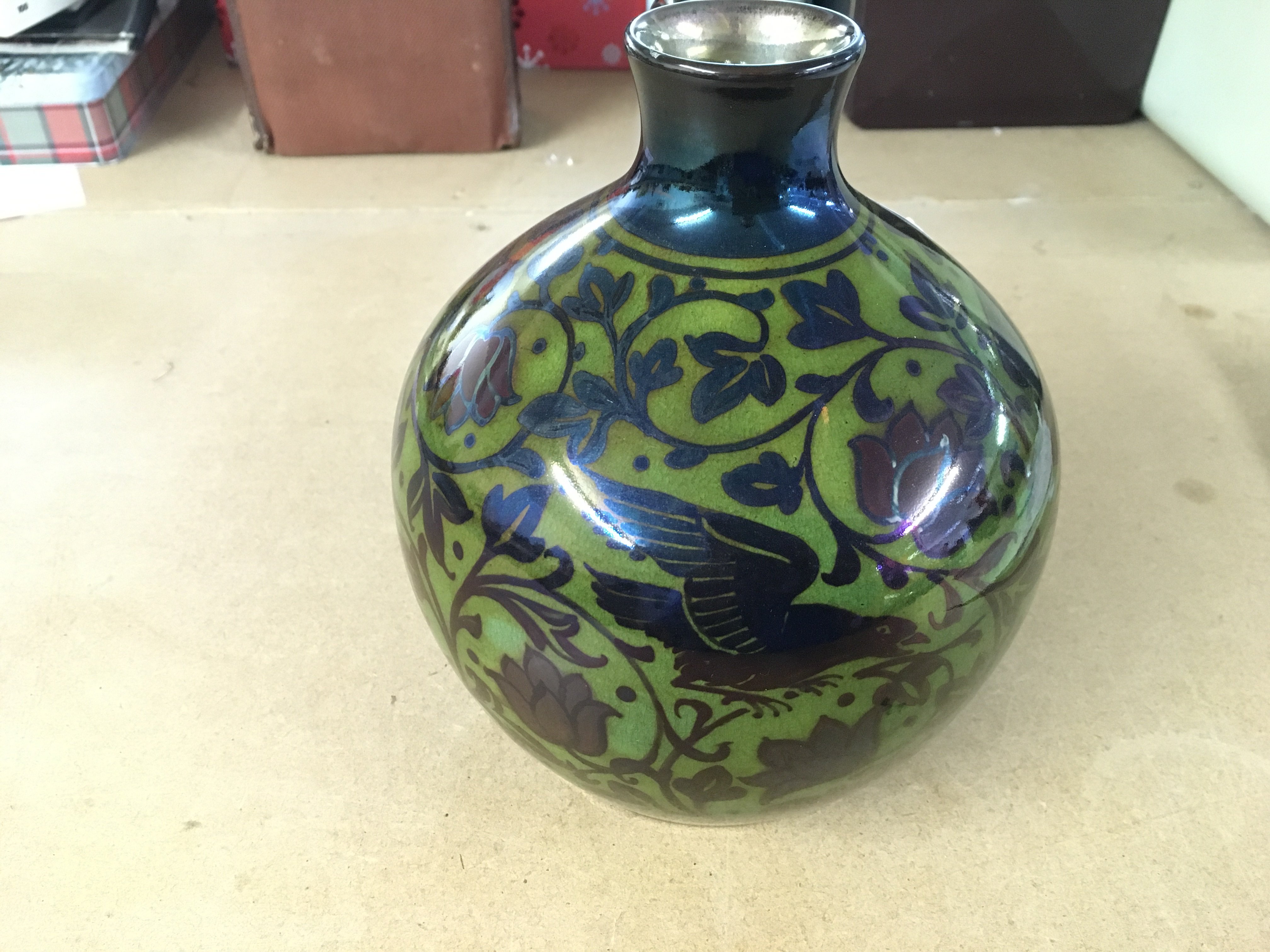 William S Mycock Pilkington Royal Lancastrian lustre base with 2 birds amongst foliage is silver luster with red flowers against a yellow Green ground.  On closer inspection there is a small chip and hairline approximately 2 inches from the top rim to the bottom