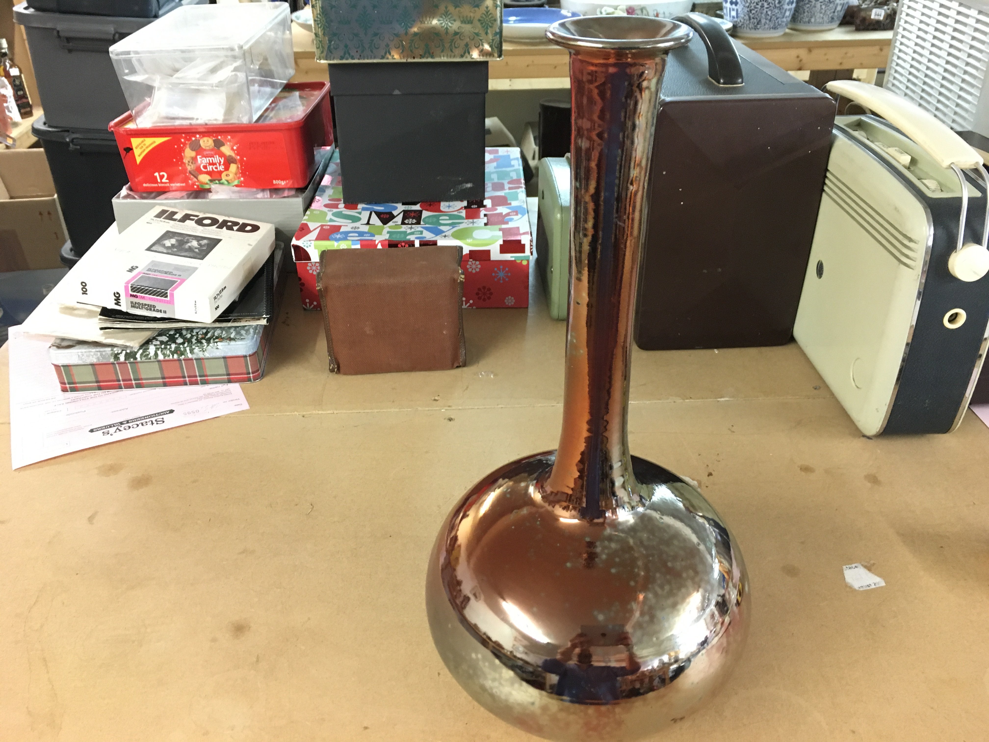 Sutton Taylor earthenware lustre ware red bottle vase with tall narrow neck. 40cm tall. Impressed ST mark. Good condition