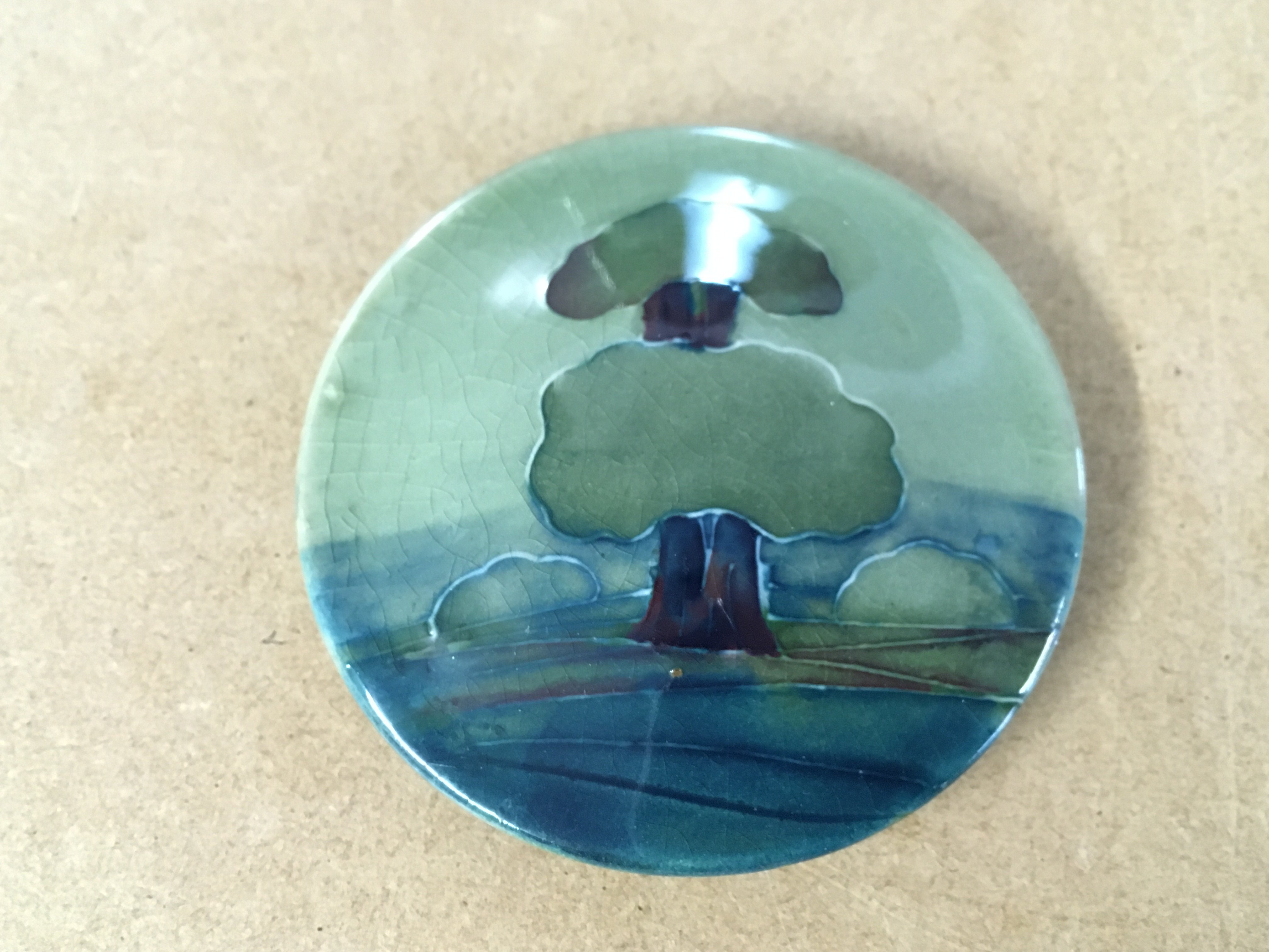 A Moorcroft Hazledene pot lid 3" diameter.