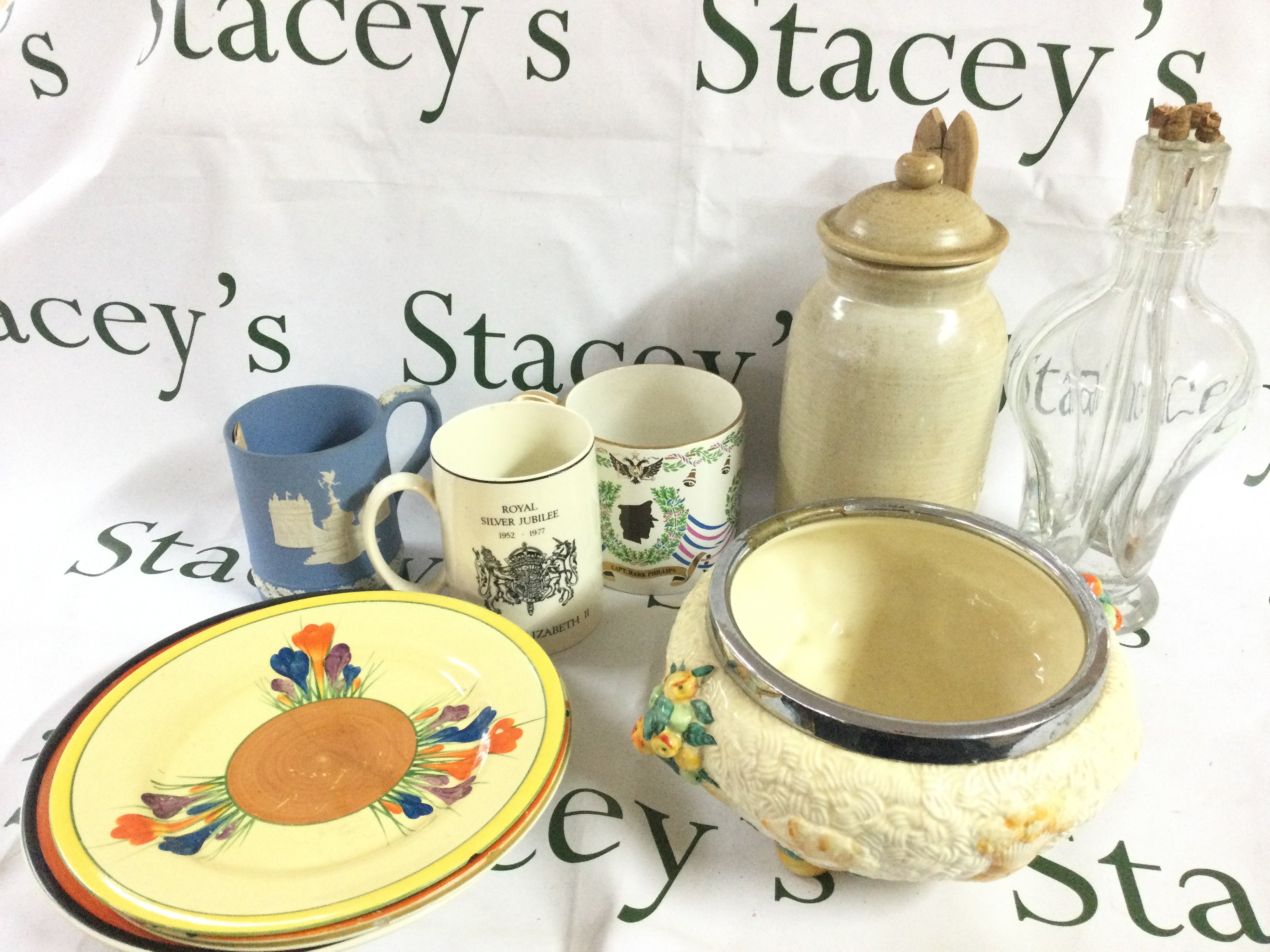 Collection of ceramics including Clarice Cliff plates, Celtic Harvest Clarice dish , Wedgwood mug etc. some damage. This lot cannot be posted