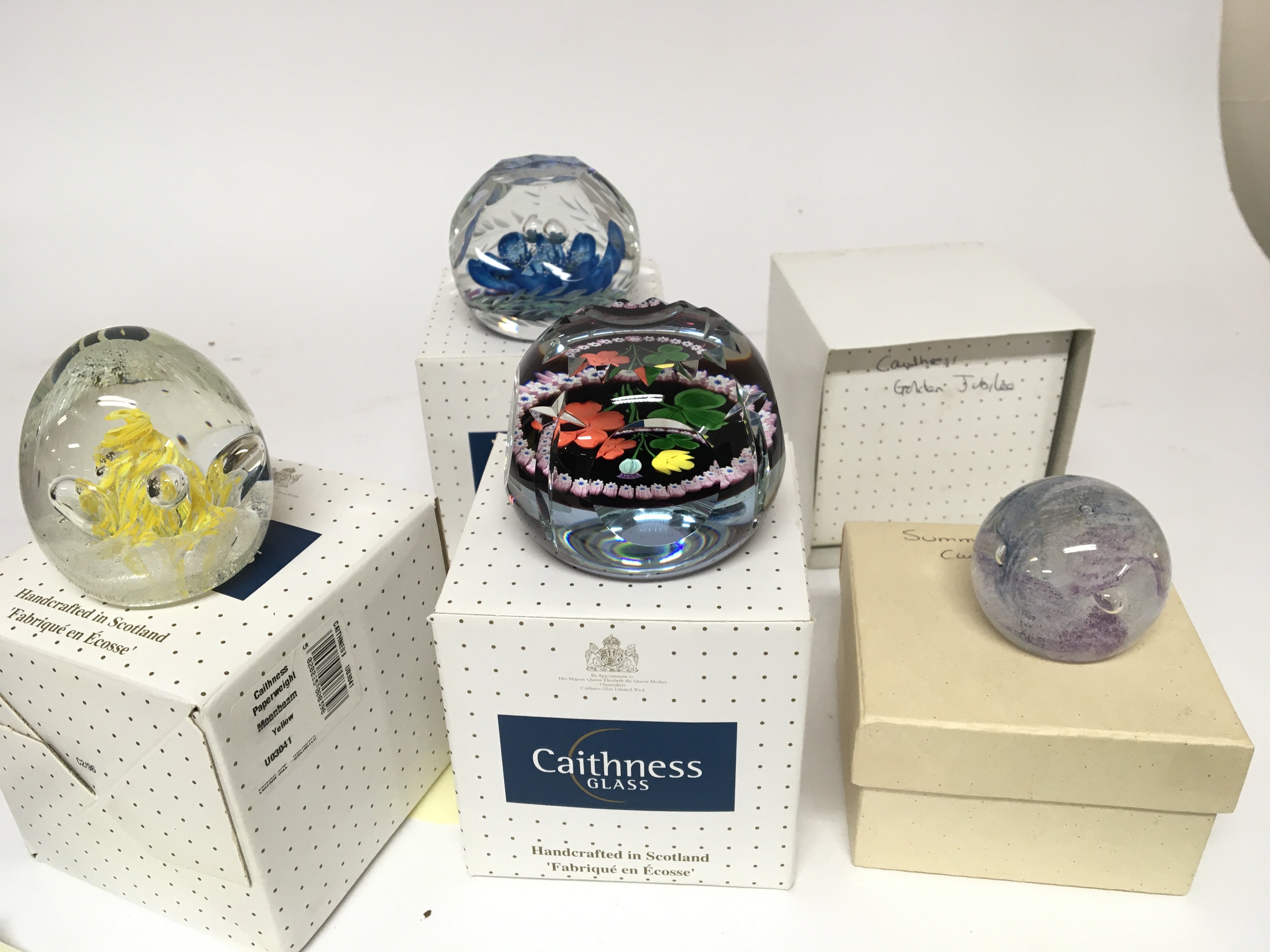 Five Caithness paperweights Golden Jubilee Blue Blossom Summer Haze Moonbeam and Coronation four Nations all in boxes (5)