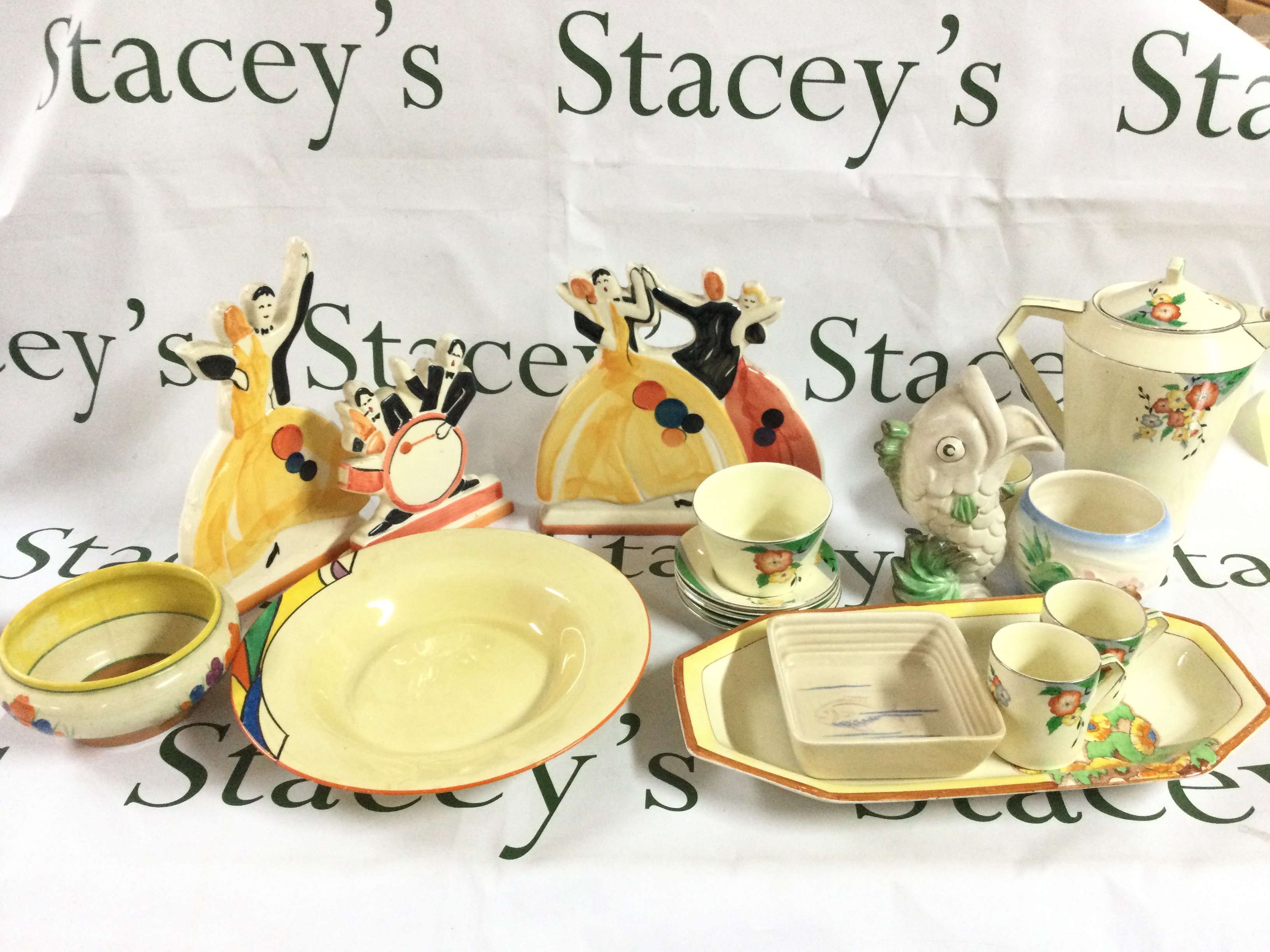 A collection of ceramics including past times Art Deco style jazz figures, Clarice Cliff fish vase, Frinton saucers , Clarice dish and bowl. This lot cannot be posted