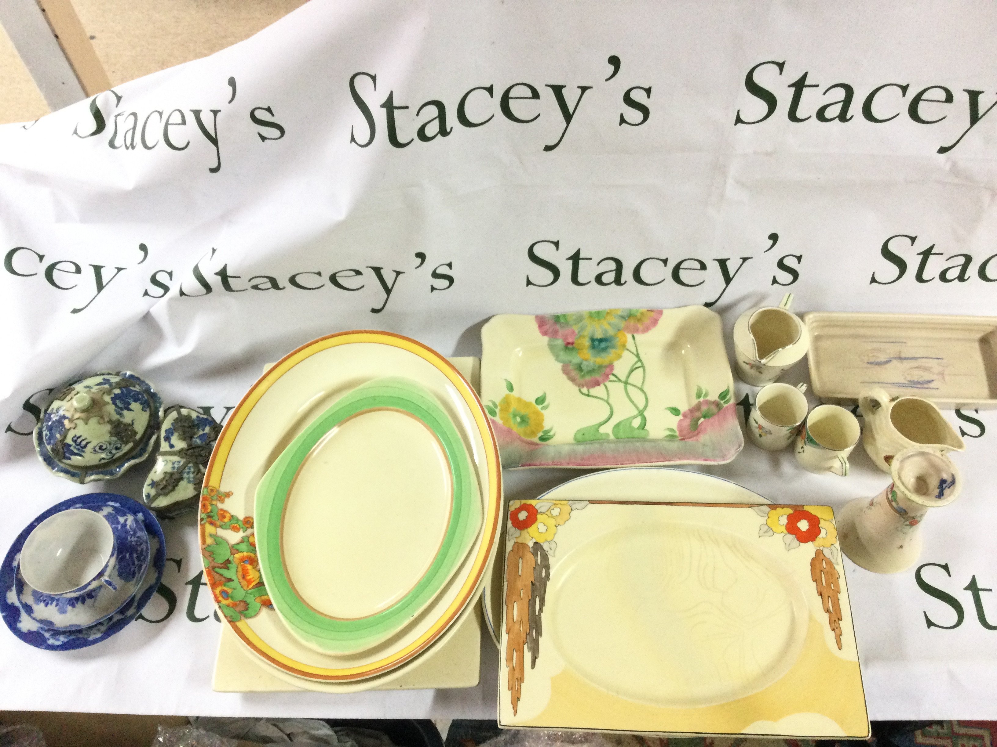 Clarice cliff ceramics including a vase , rectangular dish, oval islands dish, other dishes and Frinton cups , Japanese Blue and white ceramics , container and cup and saucers . This lot cannot be posted