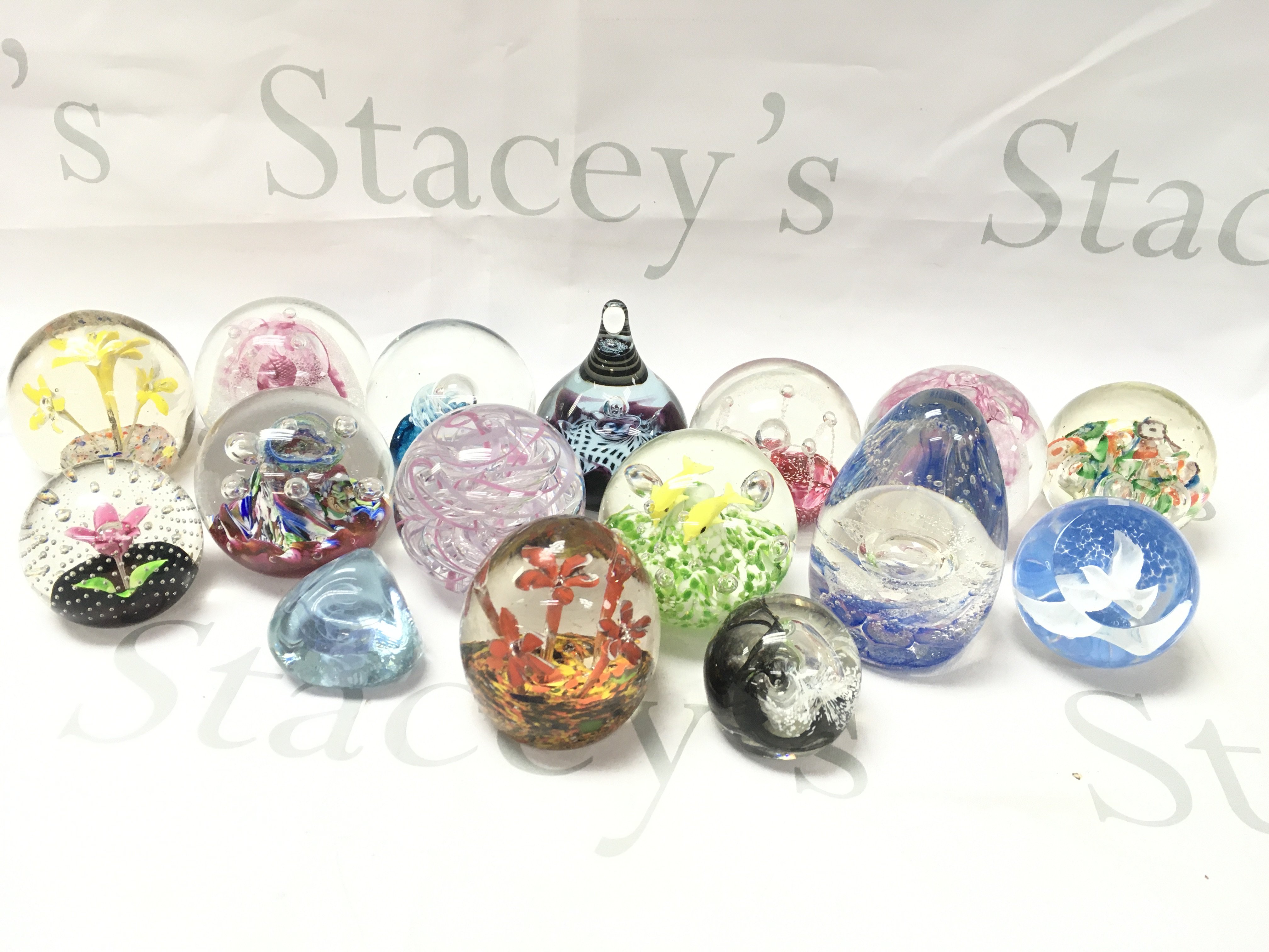 A Collection Of Glass Paper Weights.