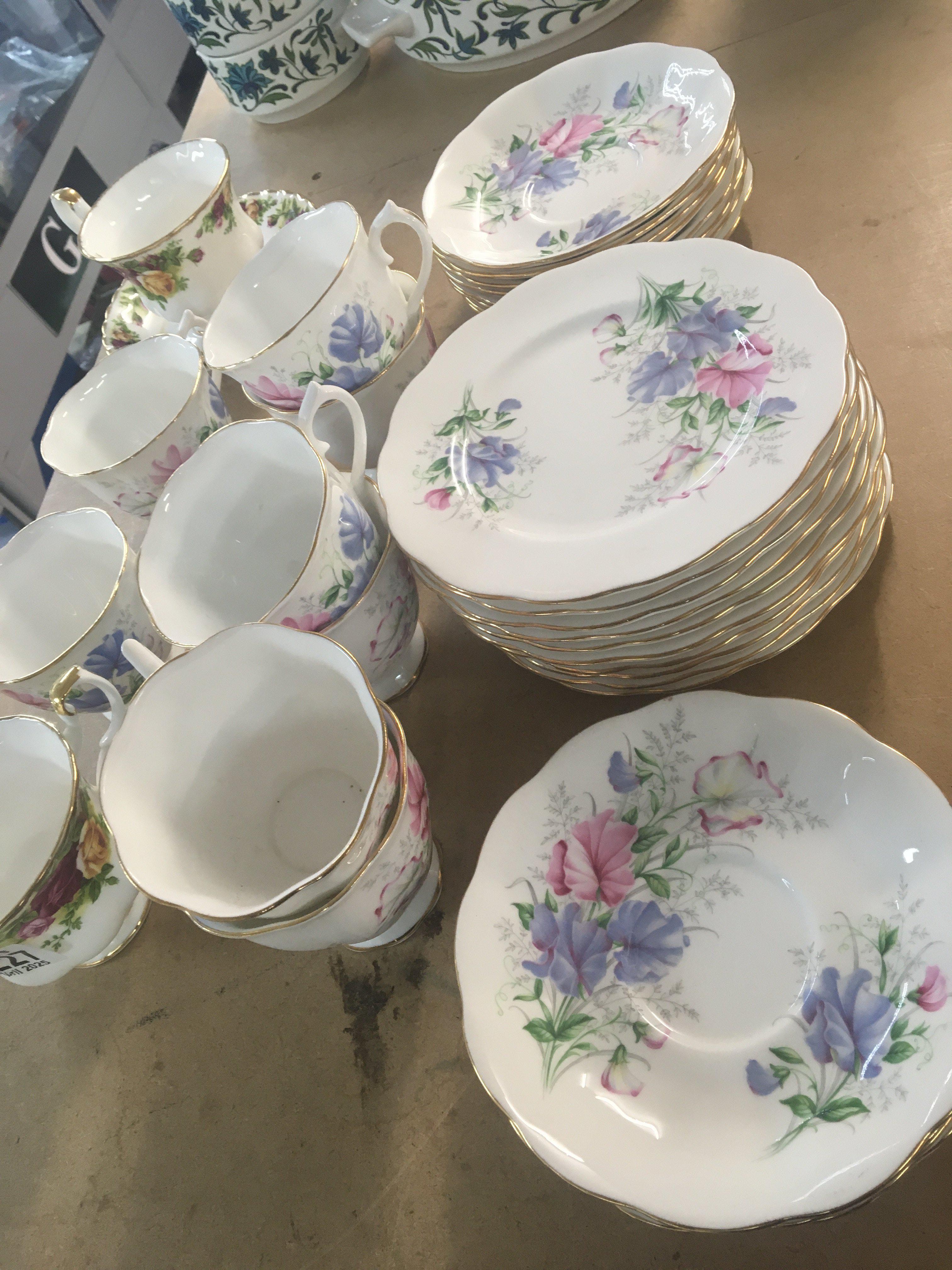 A Royal Albert bone china tea set Frendship sweet Pea pattern eight place setting with extra plates no obvious damage and Royal Albert old English country rose tea cups and saucers