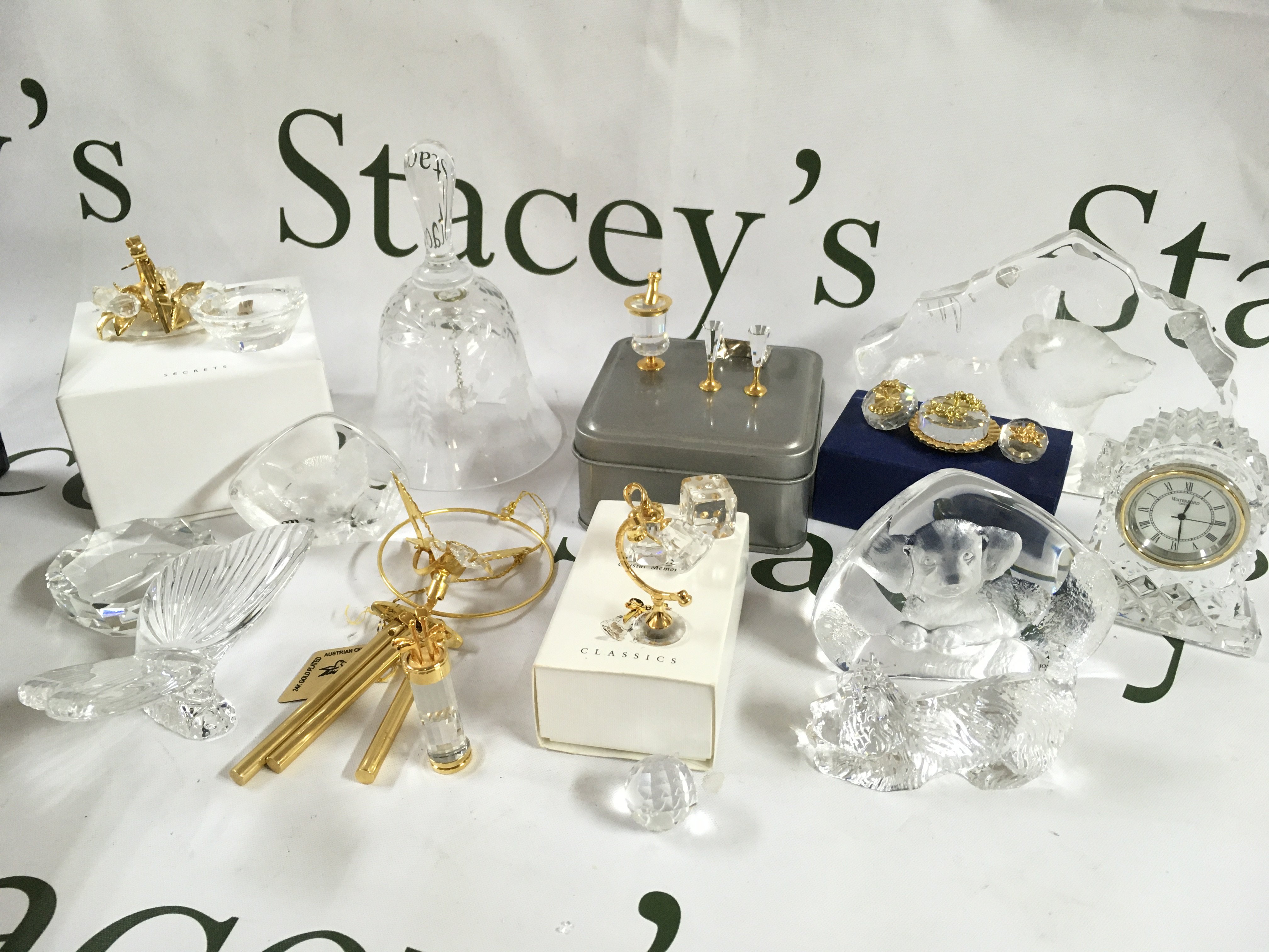 A collection of Swarovski crystal glass , Waterford and other glass ornaments . This lot cannot be posted