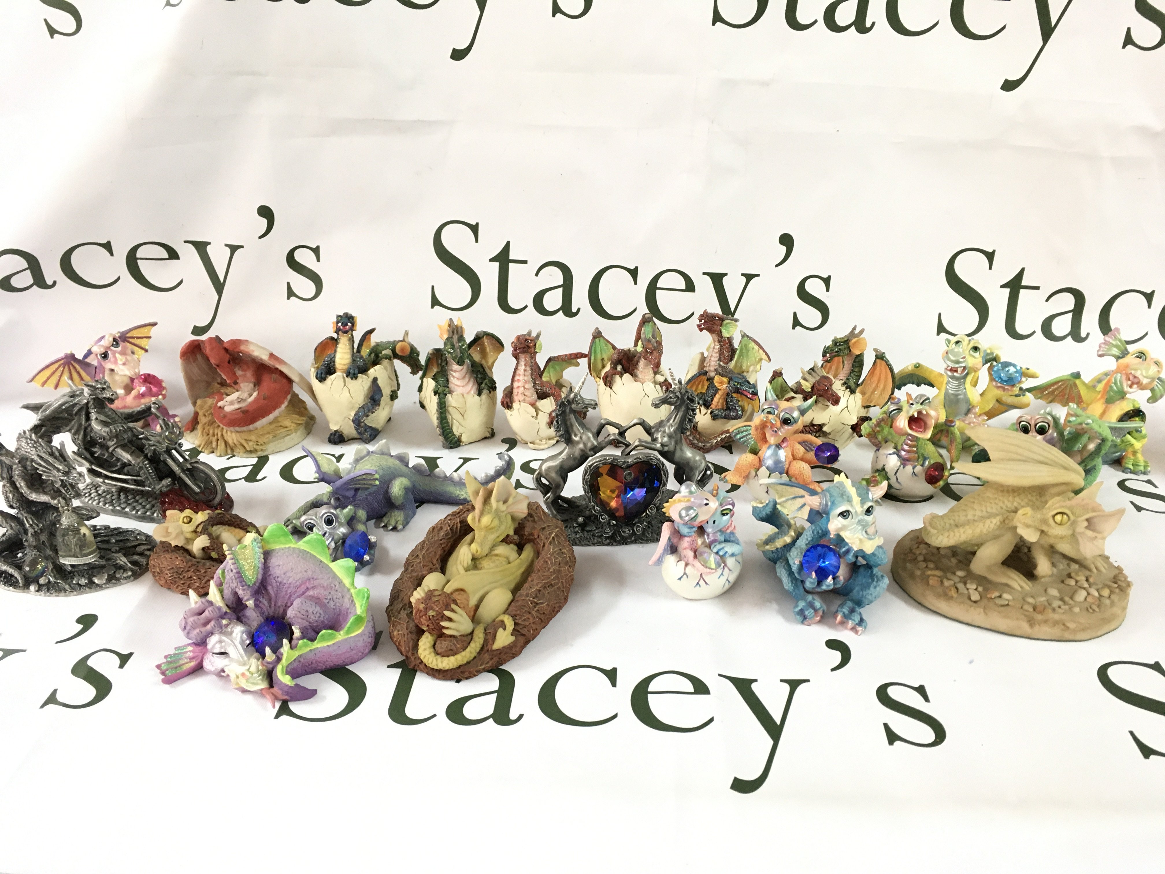 A Collection of dragon figures including Mood Dragons, Enchanted, Tudor Mint myth and magic etc. boxes included. this lot cannot be posted
