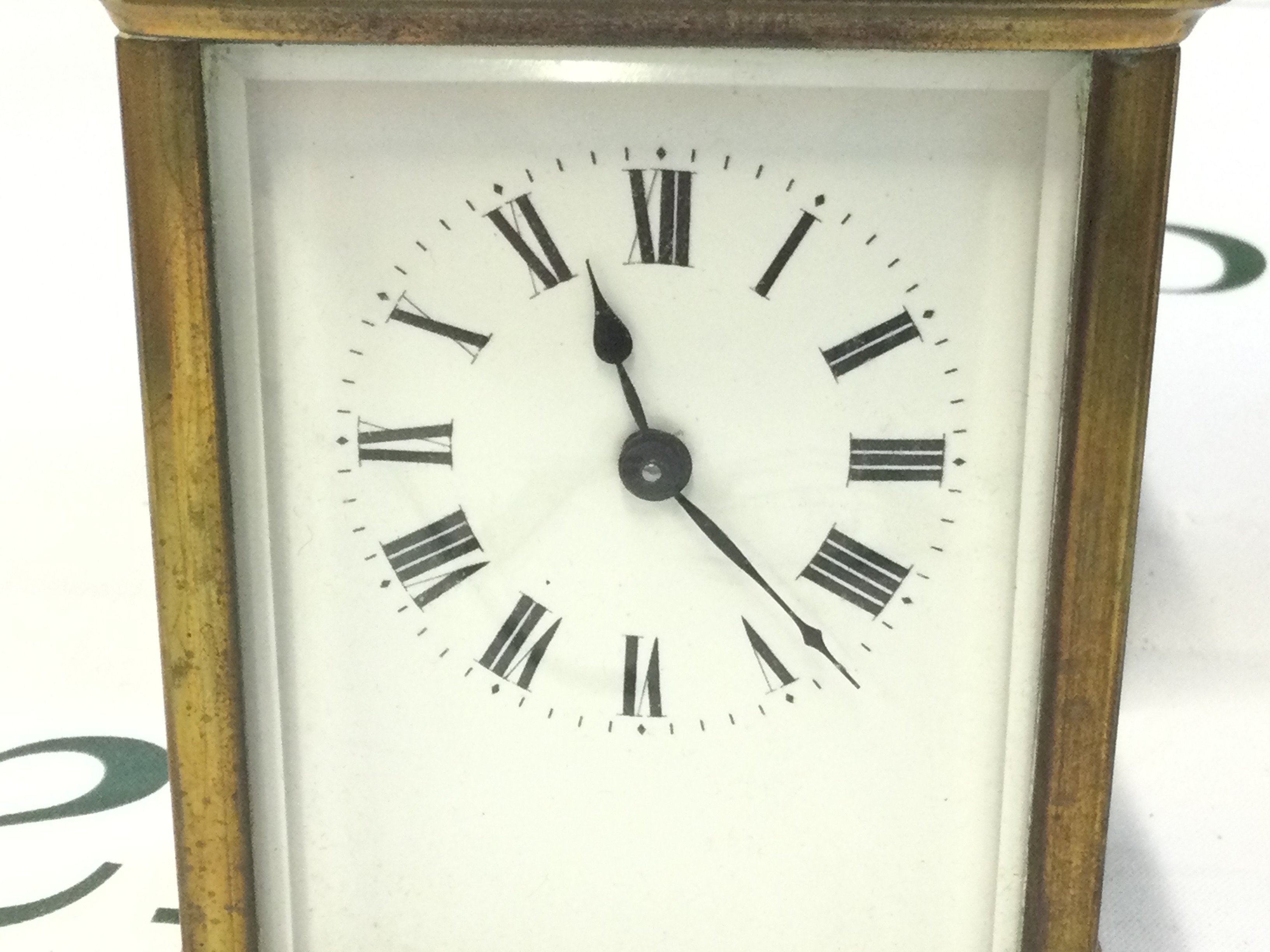 WITHDRAWN - A wooden and leather cased carriage clock (11cm tall) , made in France. This lot cannot be posted. NO RESERVE