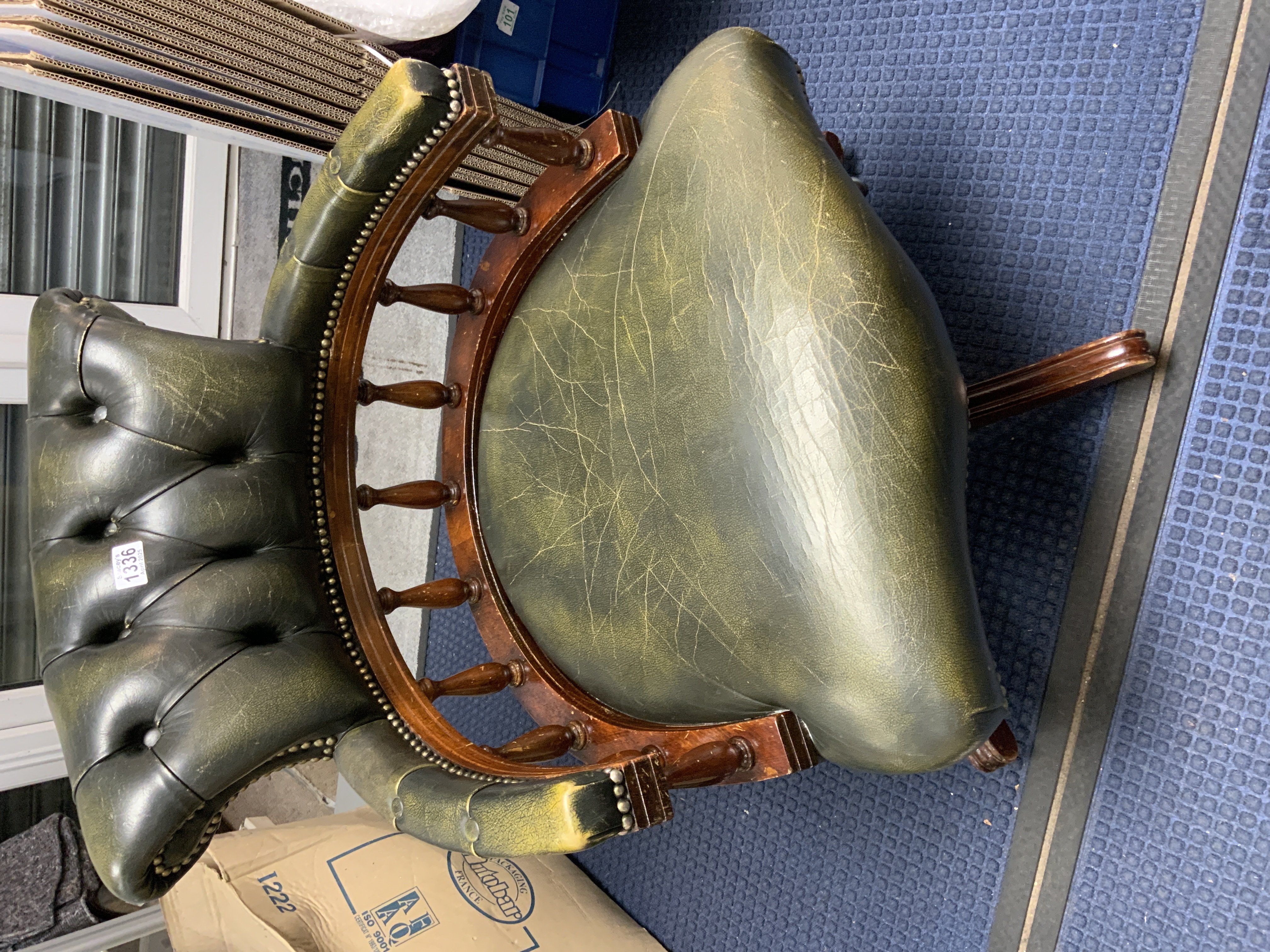A leather upholstered revolving captains chair.