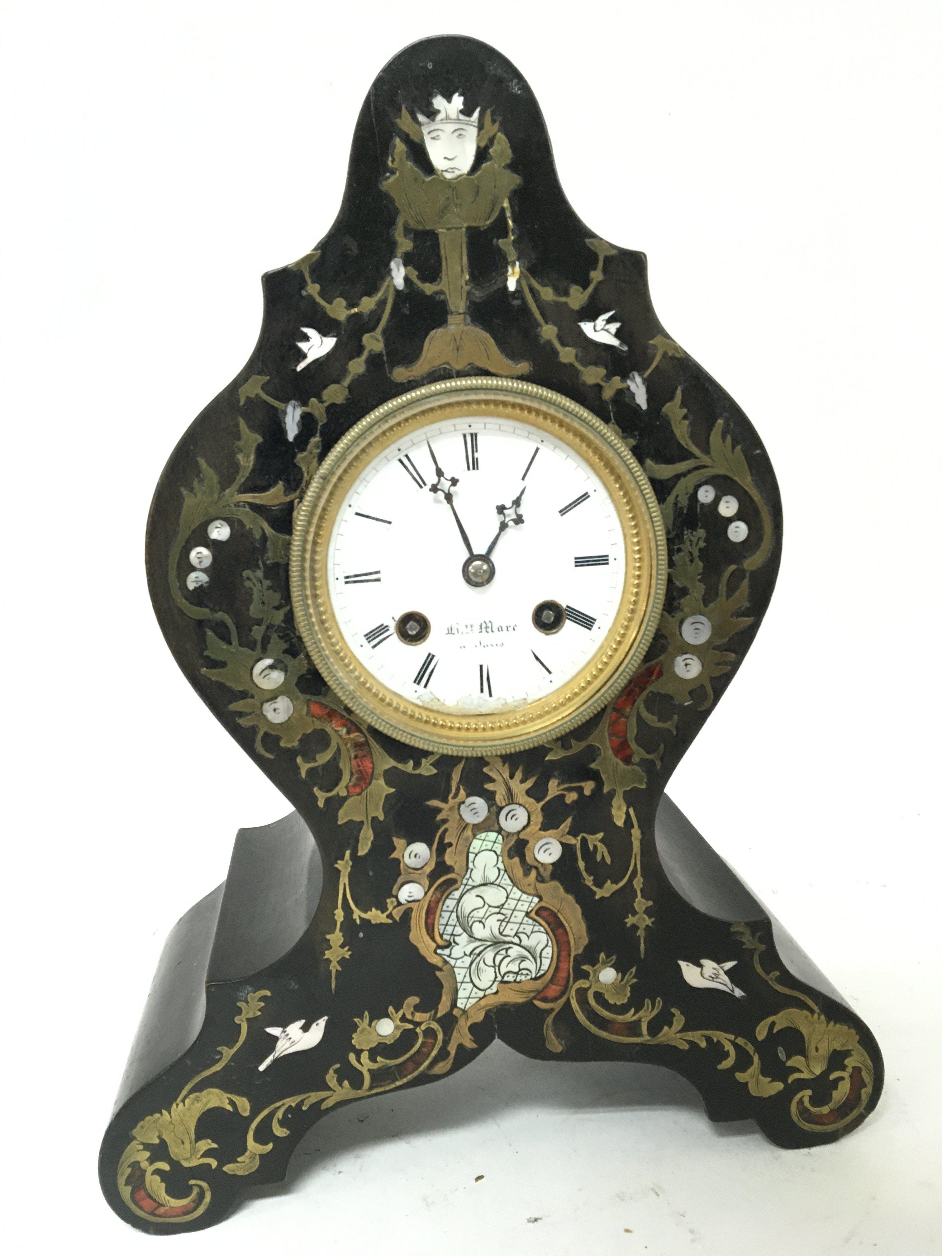 A late 19th Century French ebony veneered and brass inlaid with mother of pearl Mantel clock silk suspension movement striking on a bell and with pendulum height 32cm