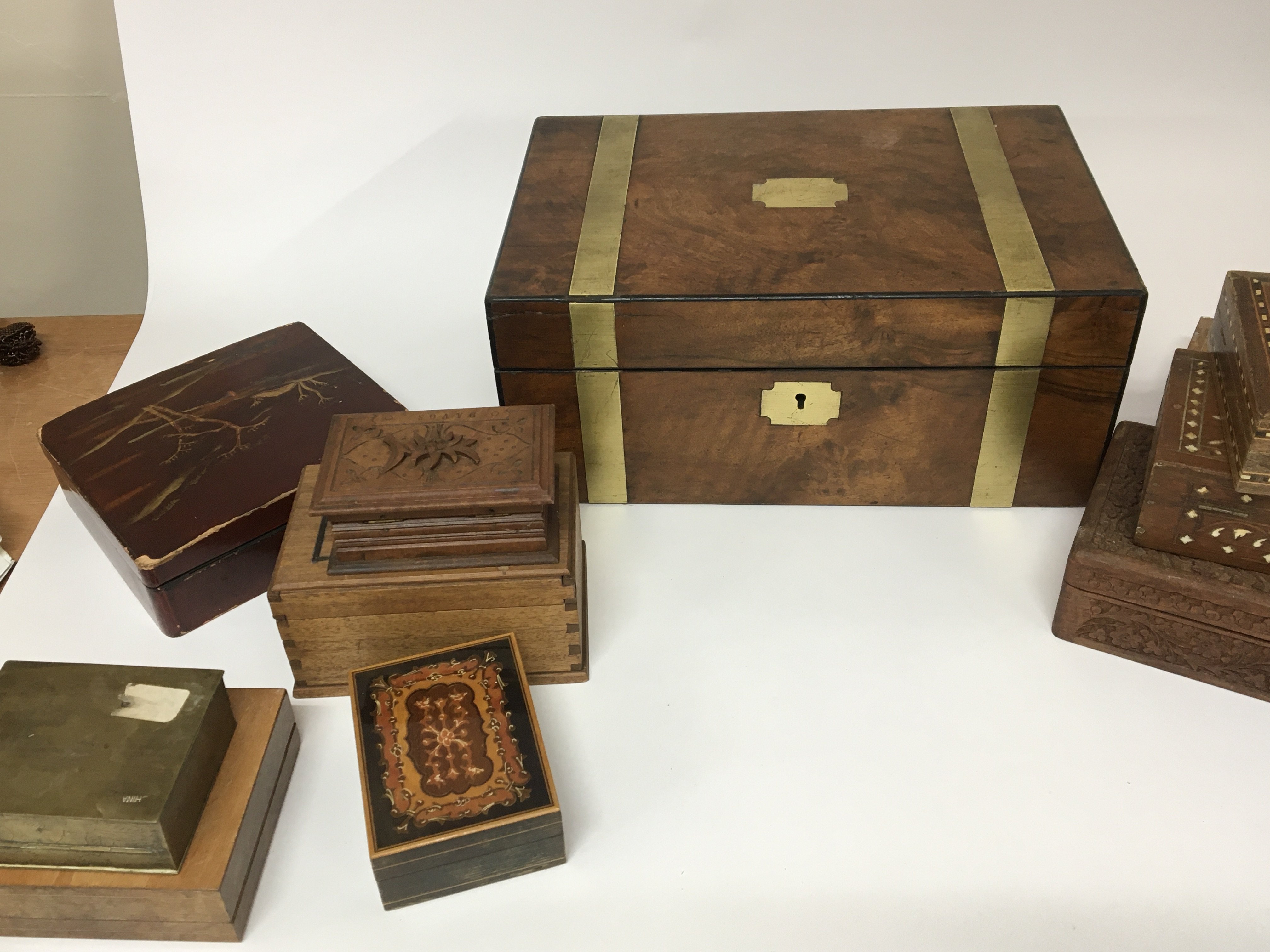 A Victorian brass bound walnut writing box for restoration a quantity of other boxes and a Victorian musical box (no mechanism)