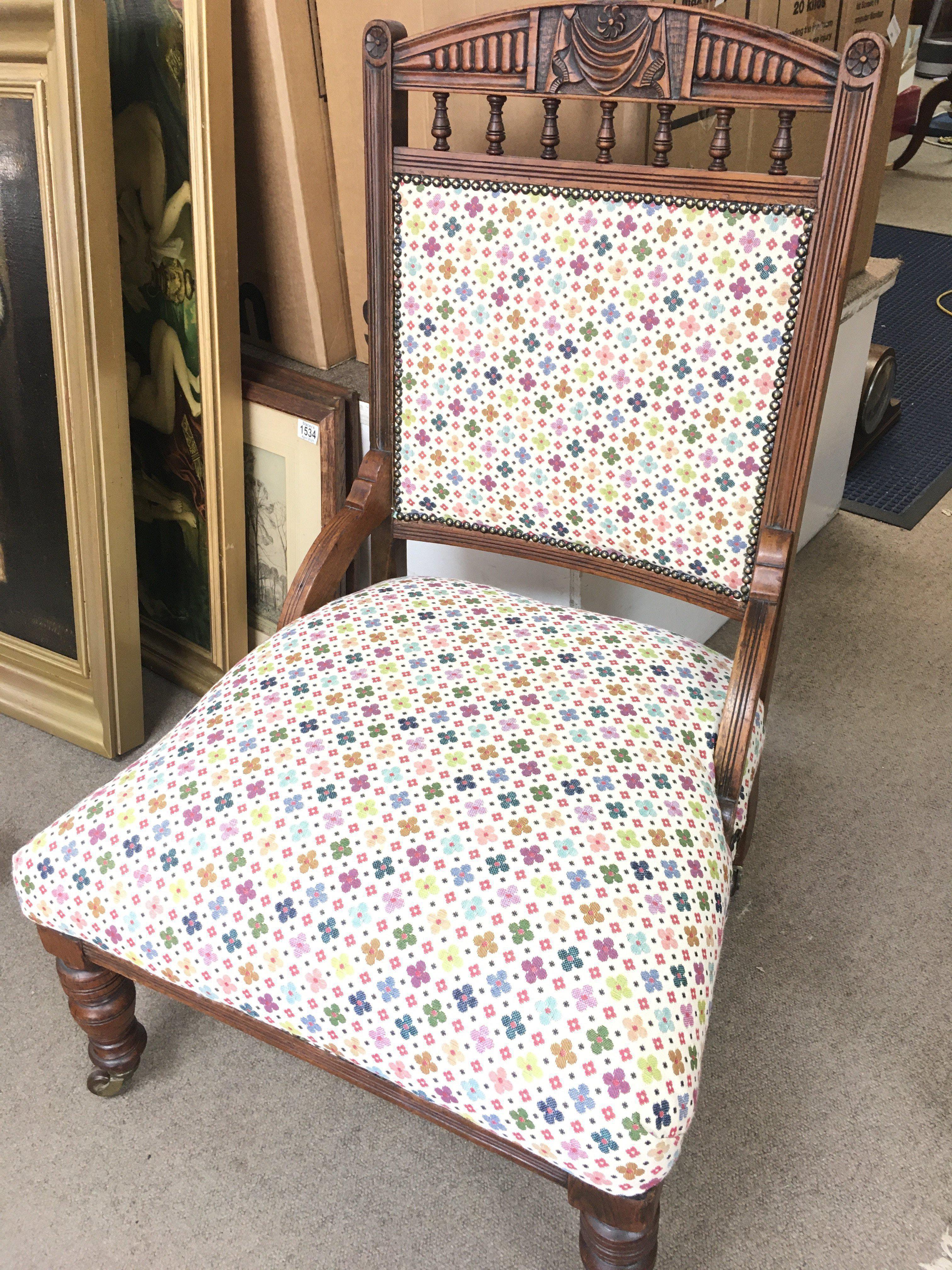 A Carved Edwardian Chair With Floral Upholstery.
