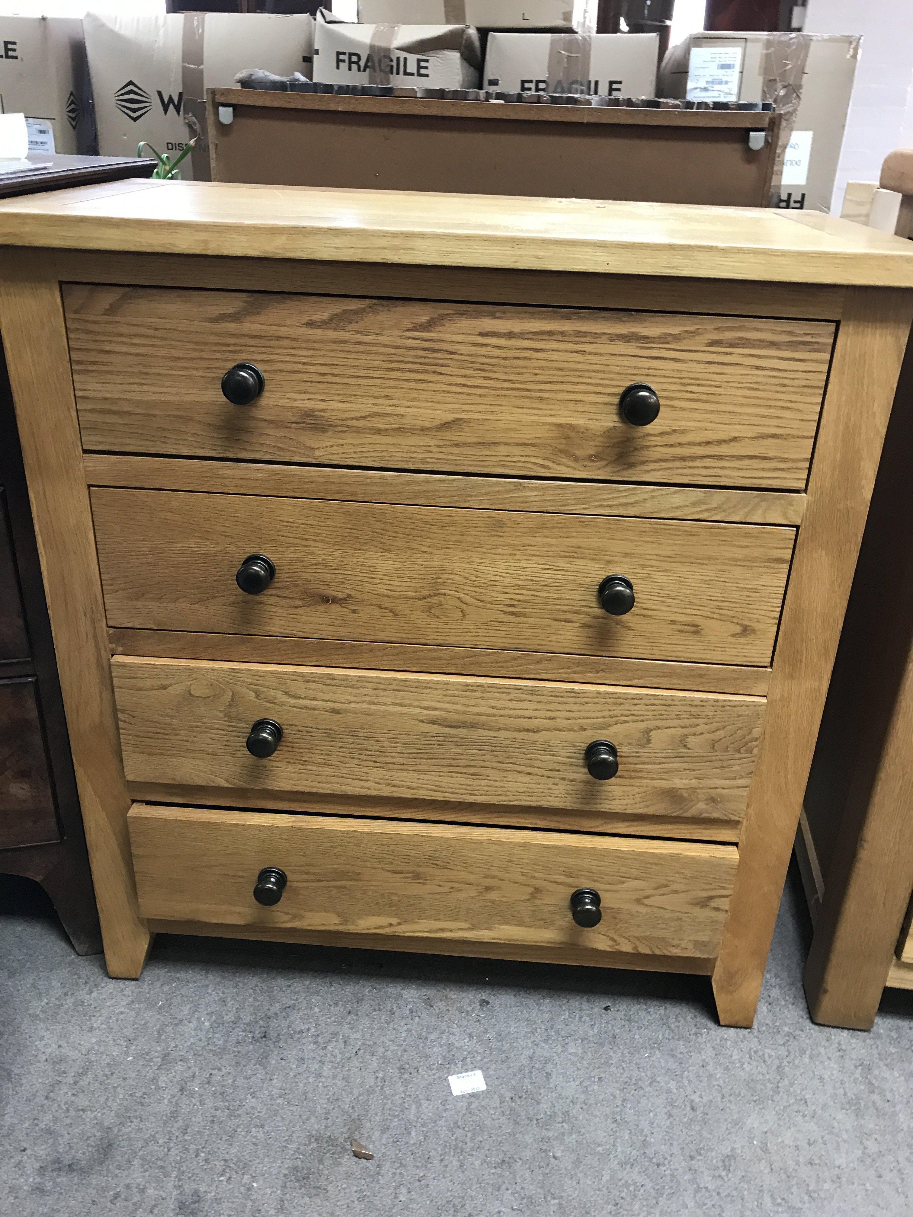 A pine chest the regular top above four drawers .