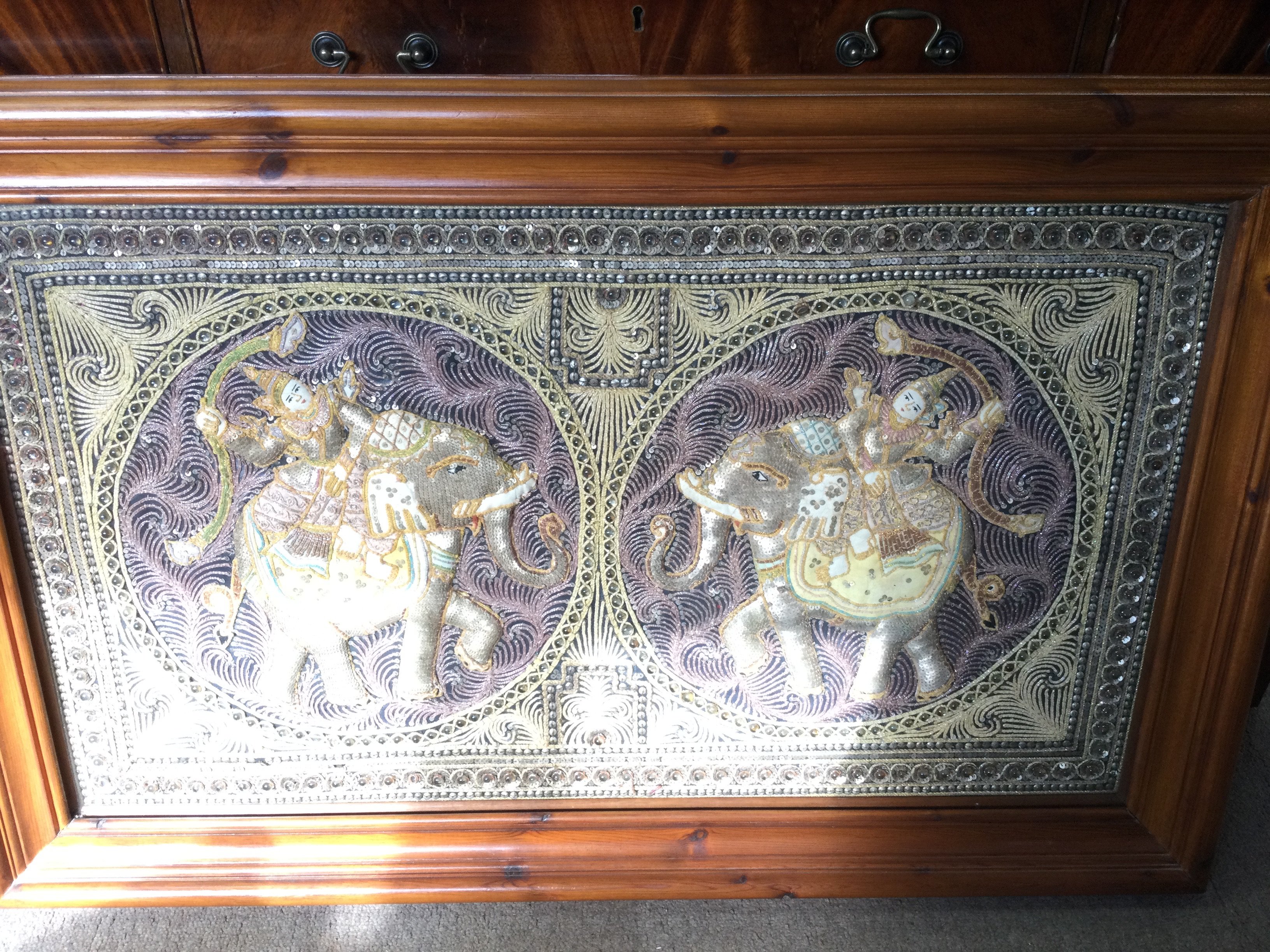 A Framed Indian Raised Embroidery. Approx Length 112CM. Height 71CM.