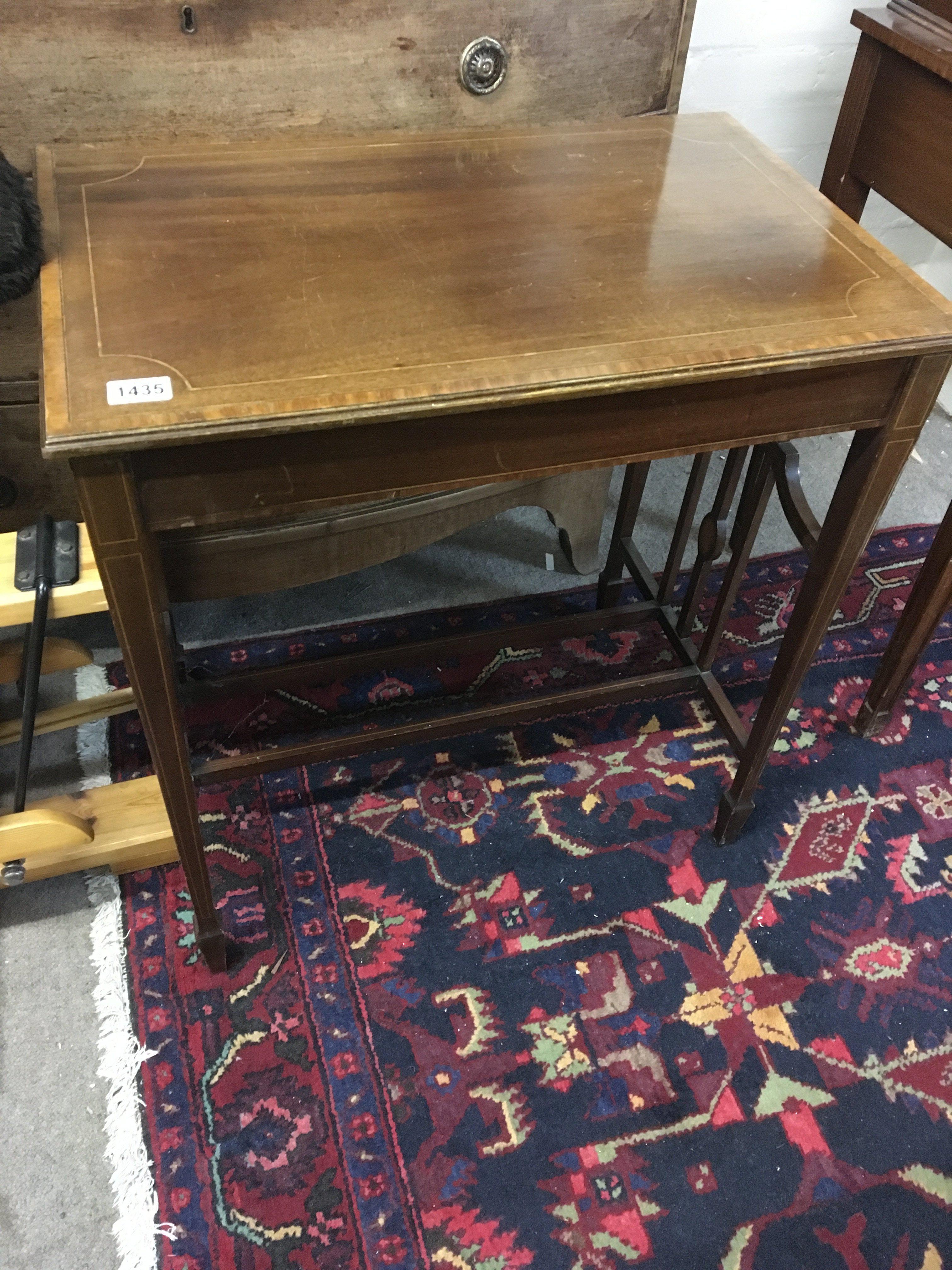 A satinwood and cross-banded occasional table the rectangular top on square legs united by stretches. 70x45cm No Reserve