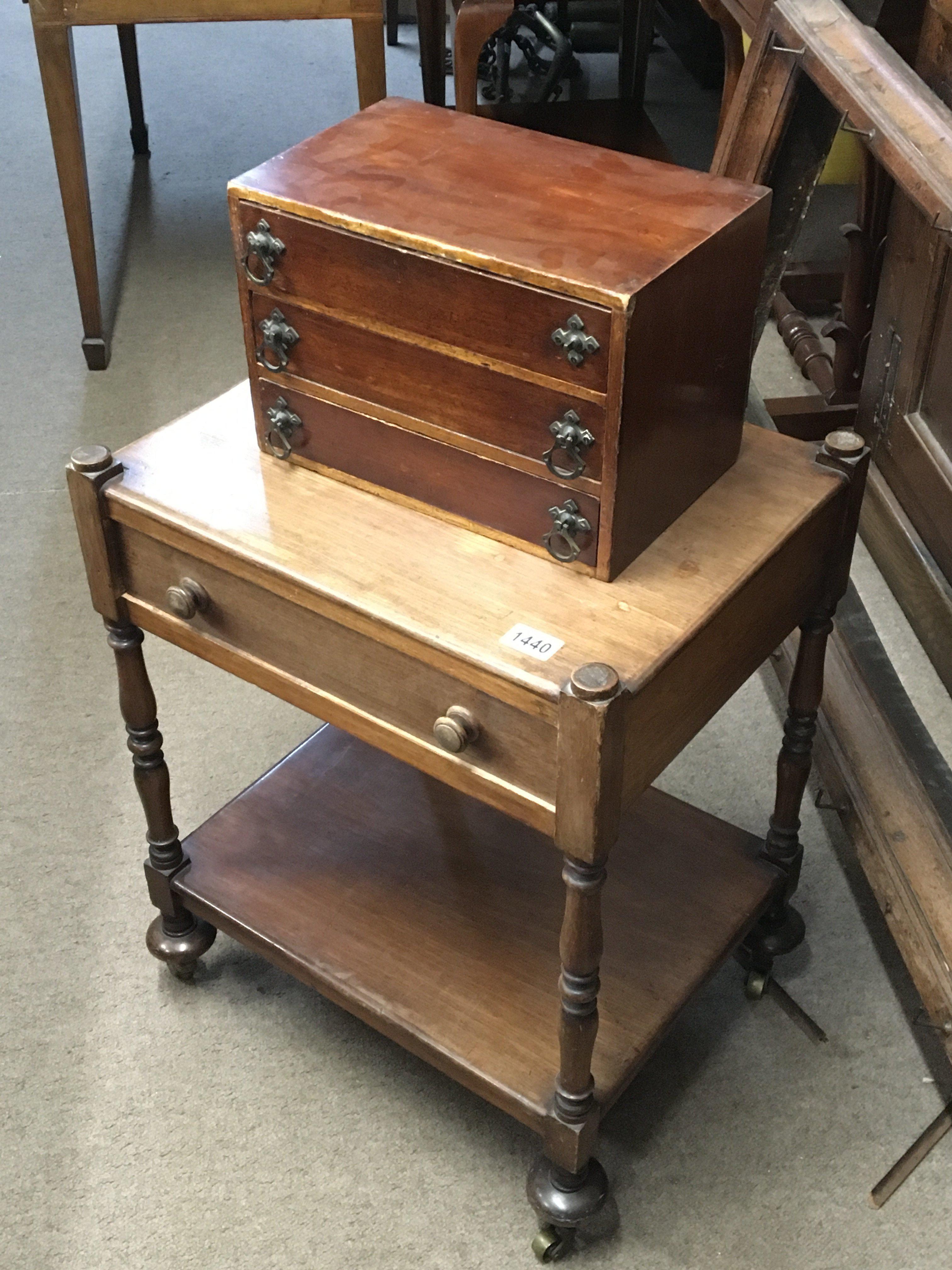 A small collectors cabinet with a flight of three drawers and a Victorian table with single drawer on turned supports (2)