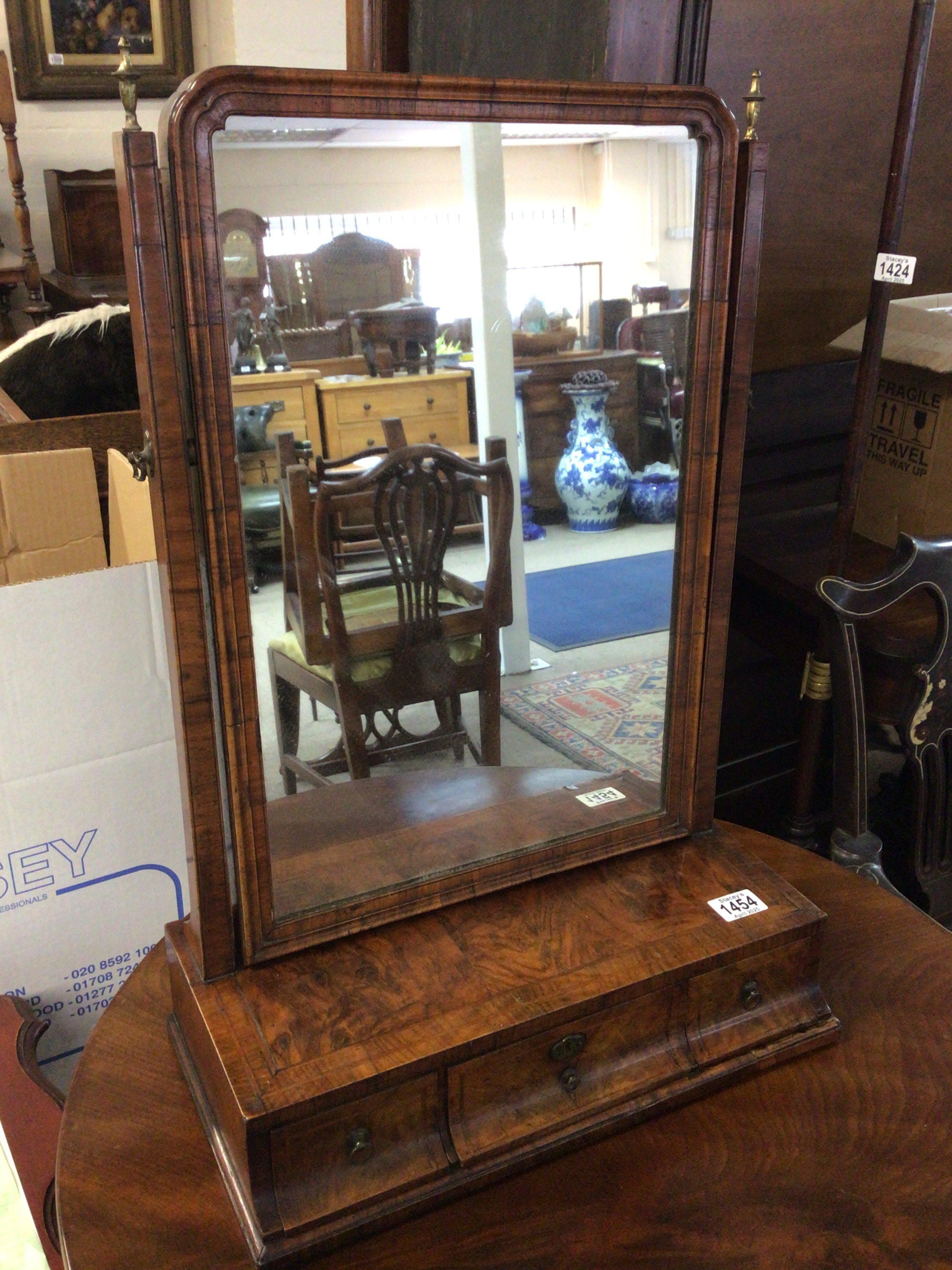 A fine George II figured walnut with fine feather banding table top dressing mirror with three drawers. Height 67cm