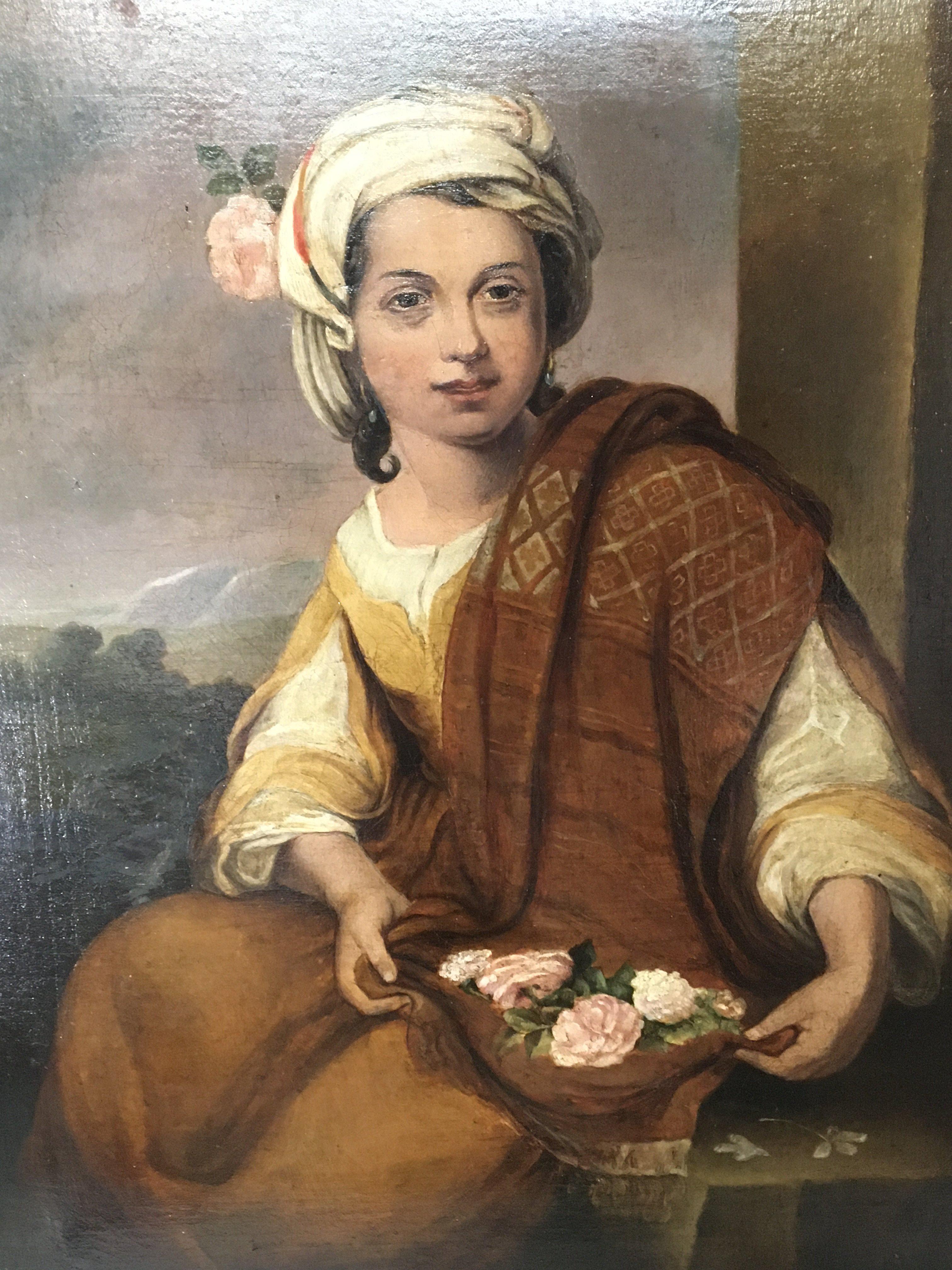 An early 19th. century oil painting on canvas of a young girl holding a collection of flowers The flower girl a perfection of spring a copy of the original by Bartolme Esteban Murillo. unsigned the painting relined and with repair. 83x67cm